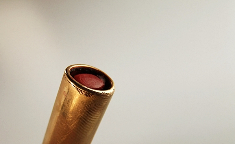 Cartier 18 K yellow gold and black enamel lipstick case pendant