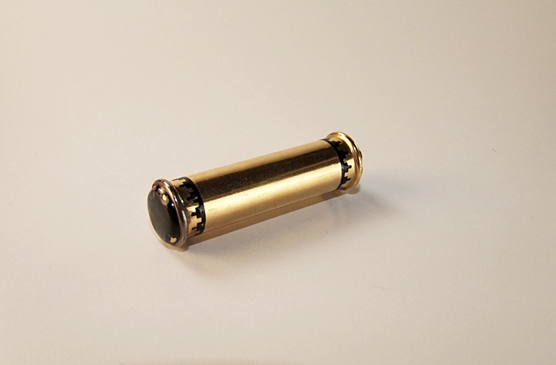 Cartier 18 K yellow gold and black enamel lipstick case pendant