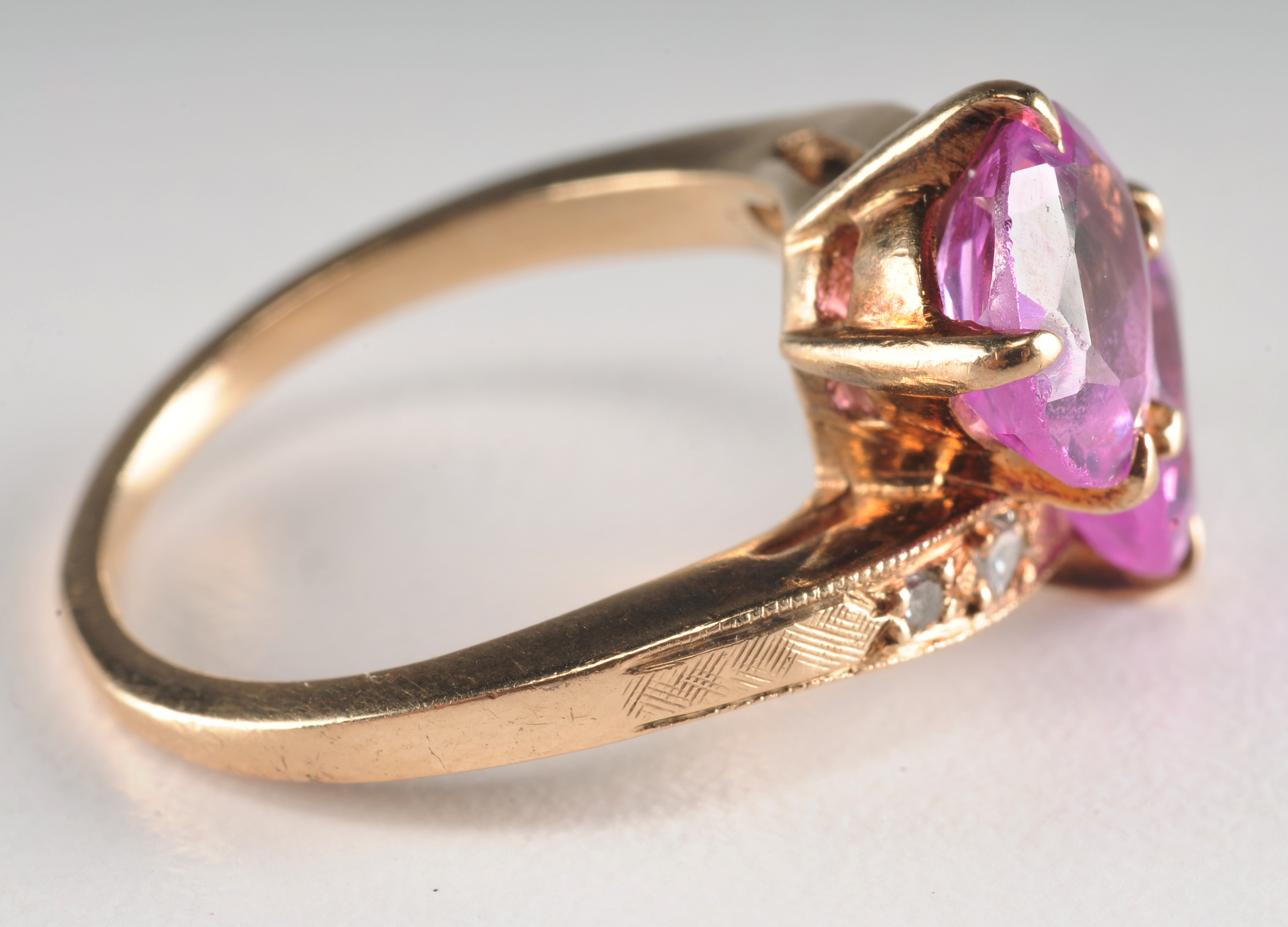 Ladies 14 K yellow gold ring with synthetic pink sapphires and diamonds