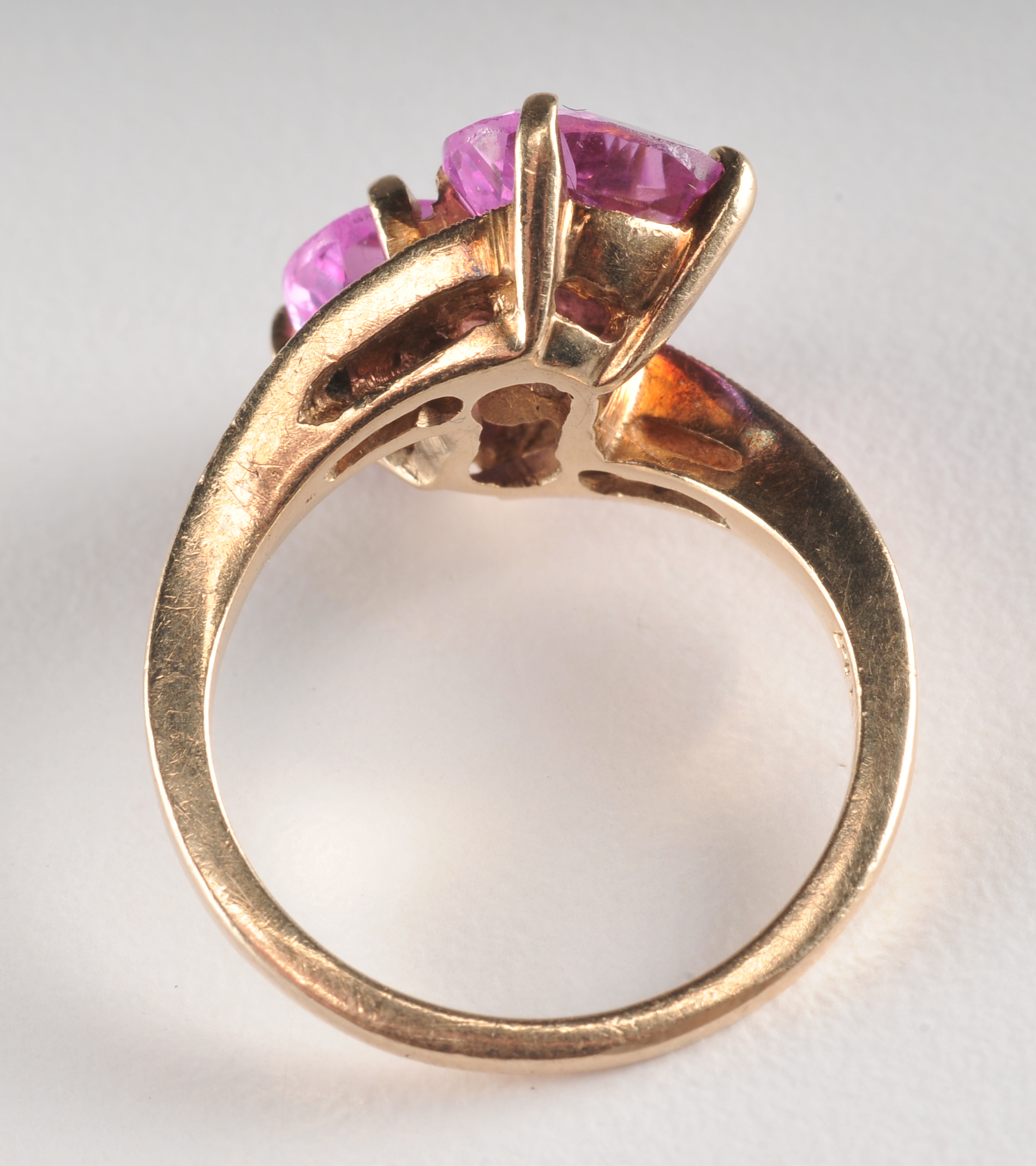 Ladies 14 K yellow gold ring with synthetic pink sapphires and diamonds