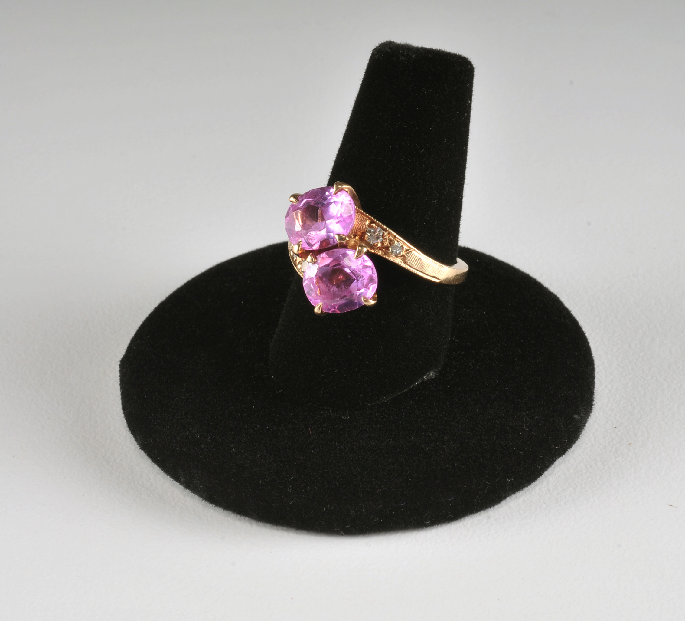 Ladies 14 K yellow gold ring with synthetic pink sapphires and diamonds