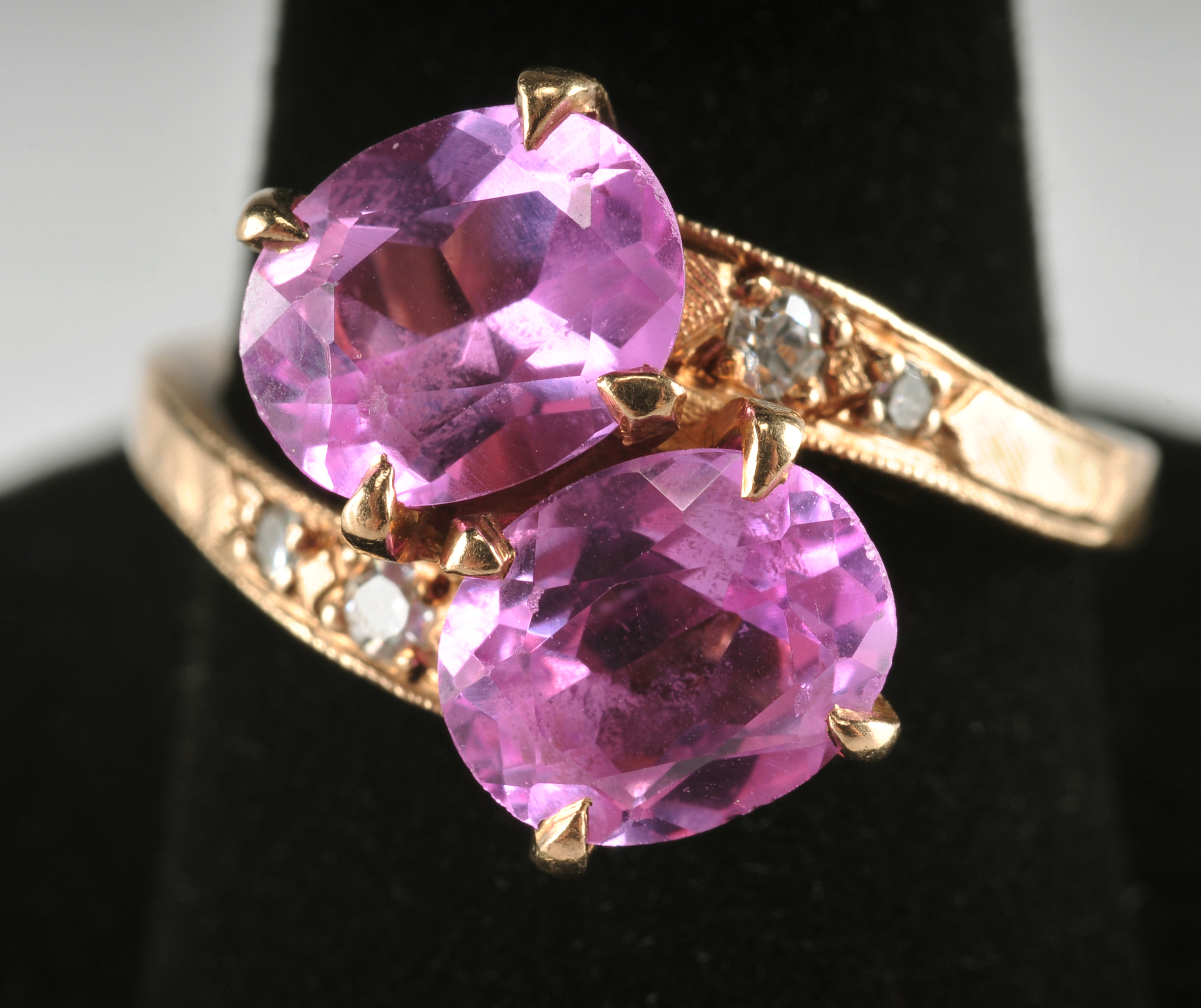 Ladies 14 K yellow gold ring with synthetic pink sapphires and diamonds