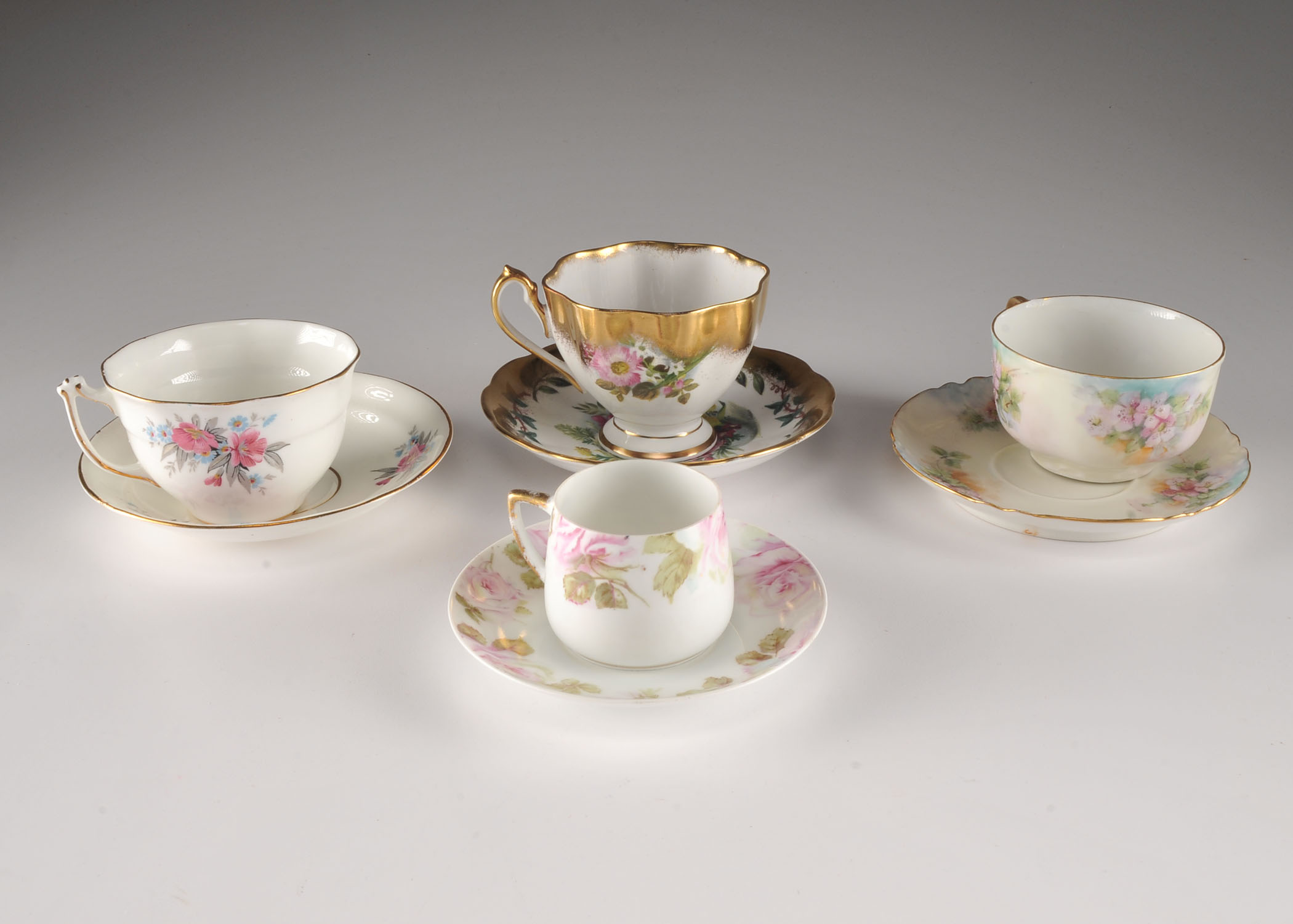 Four pretty vintage tea cup and saucers