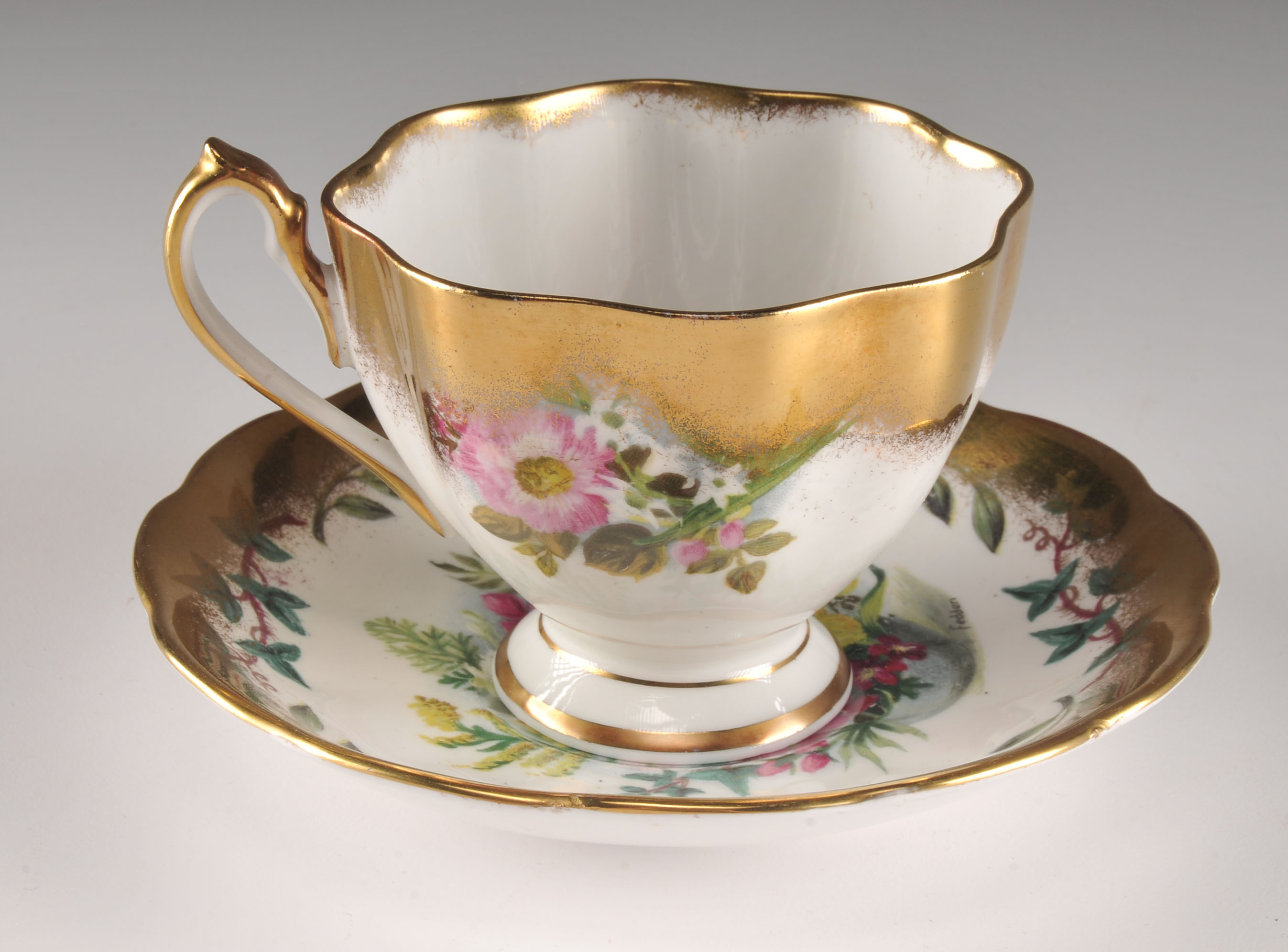 Four pretty vintage tea cup and saucers