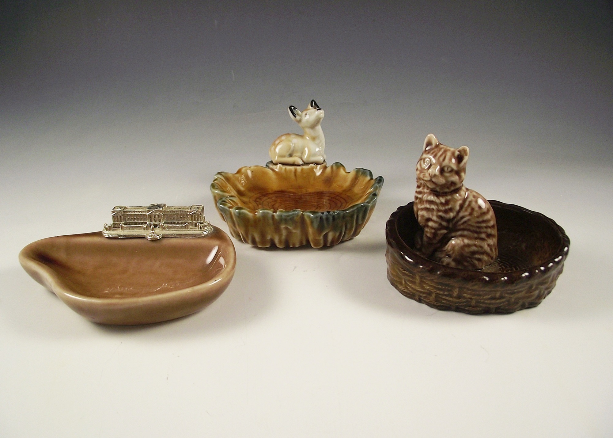 Group of Wade porcelain pin trays.