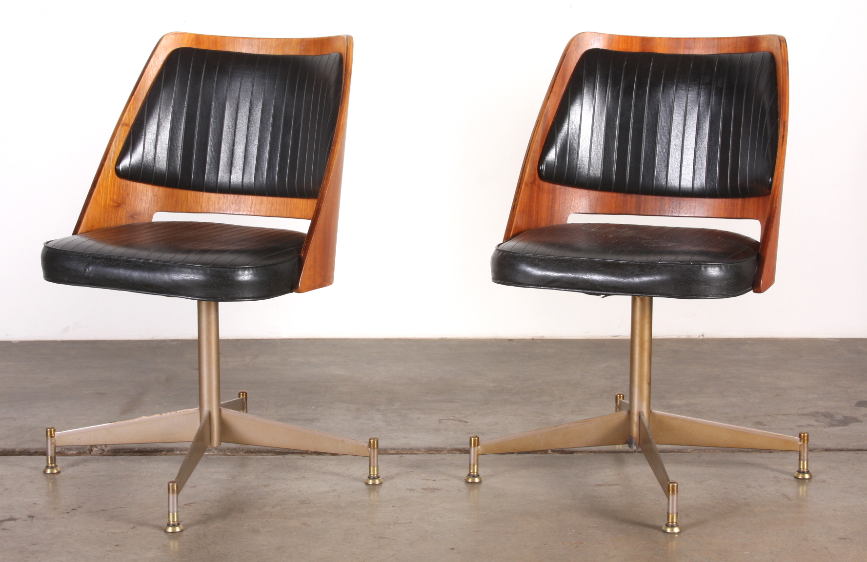 Pair of B. Brody Molded Wood Swivel Chairs