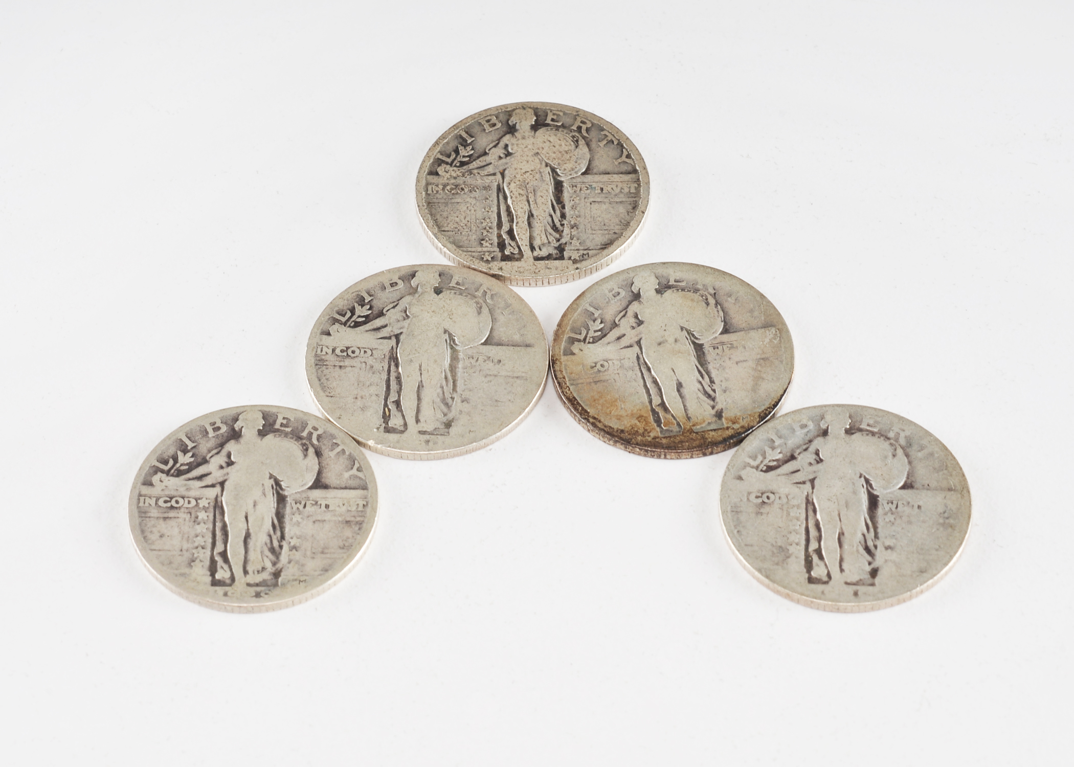 Group of (5) silver Standing Liberty quarters with unreadable dates