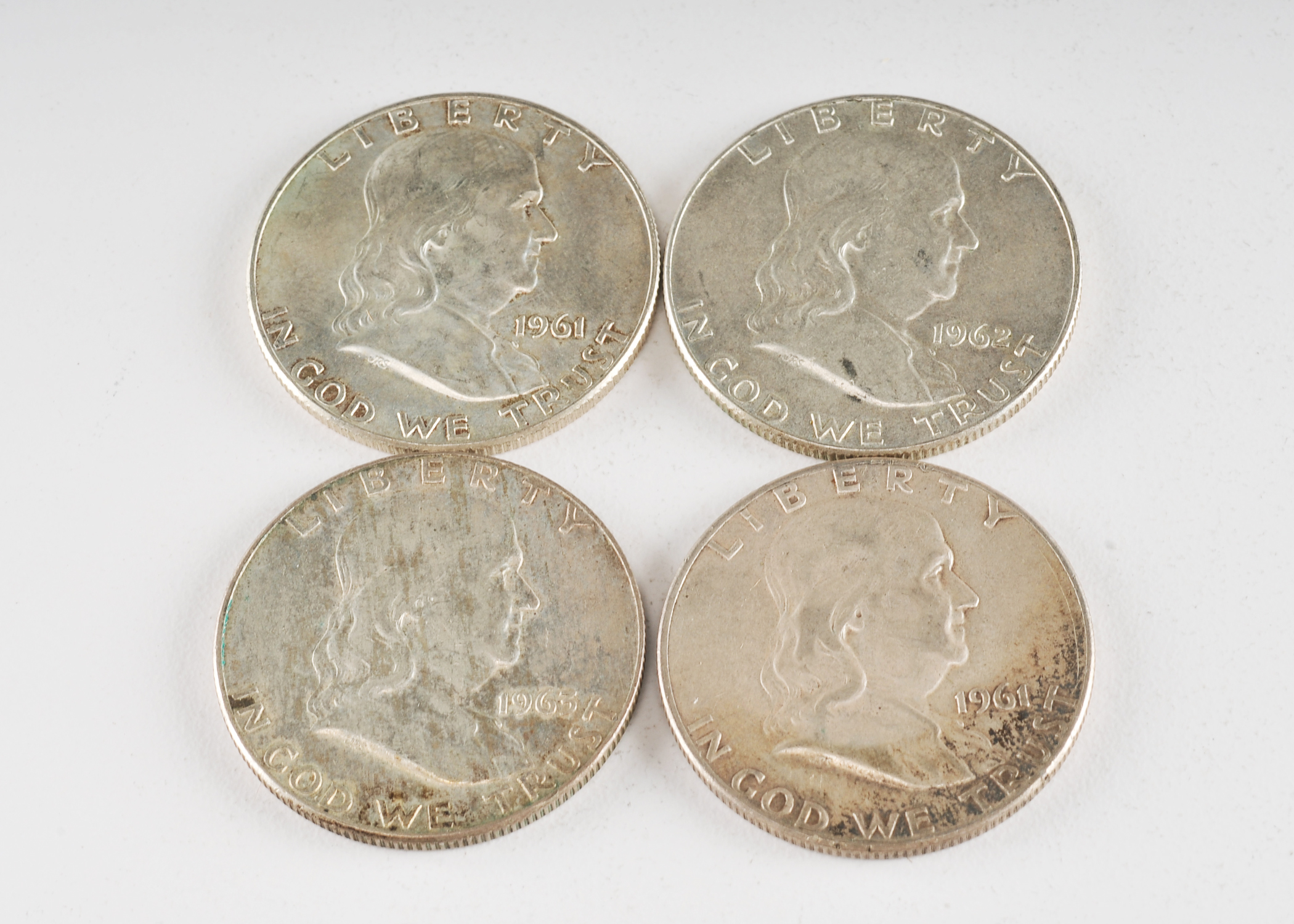 Group of (4) Franklin silver half dollars including the following: (1) 1961, (1) 1961 D, (1) 1962 D, and (1) 1963 D