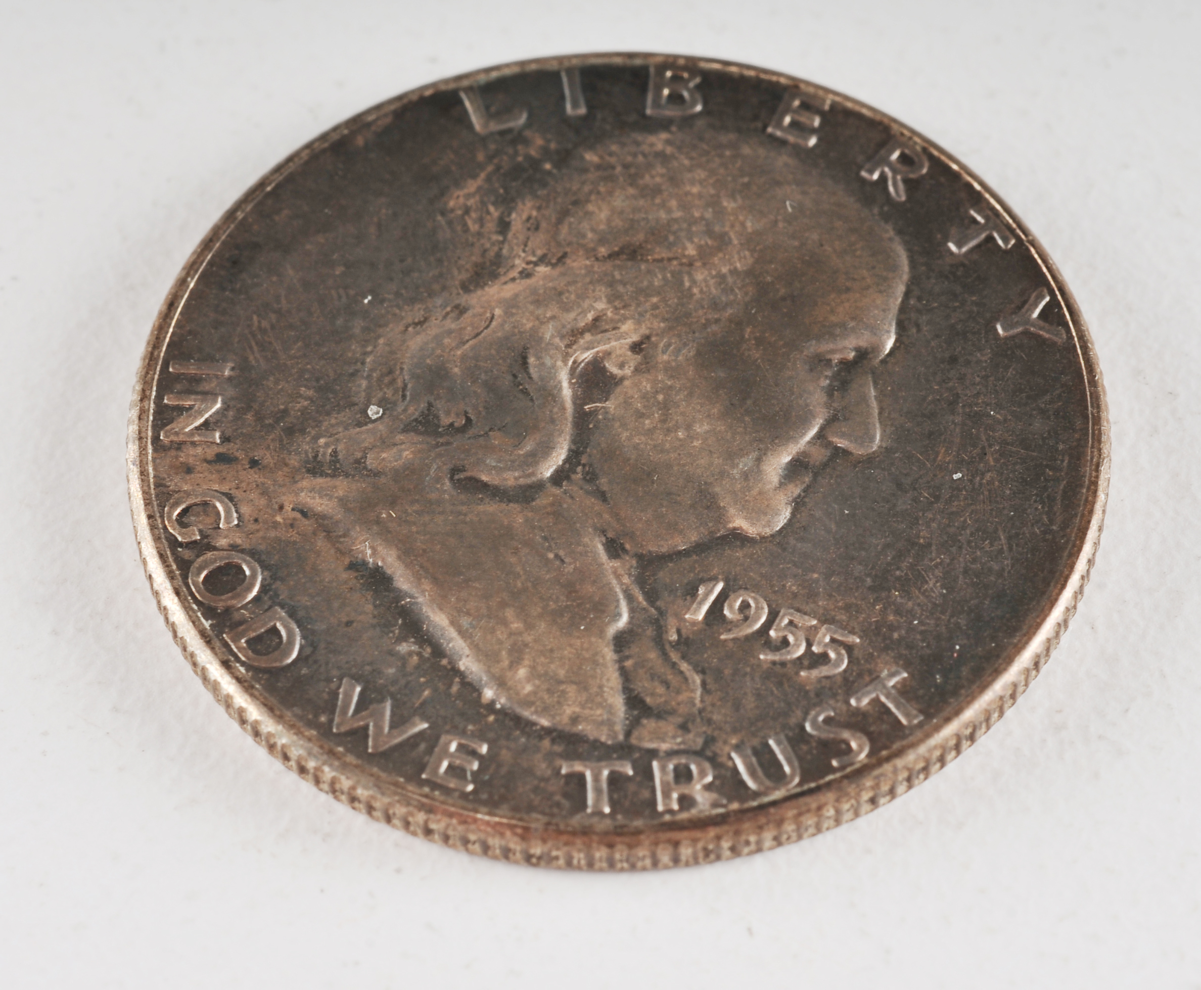 Group of (4) Franklin silver half dollars including the following: (2) 1952 D, (1) 1953 D, and (1) 1955