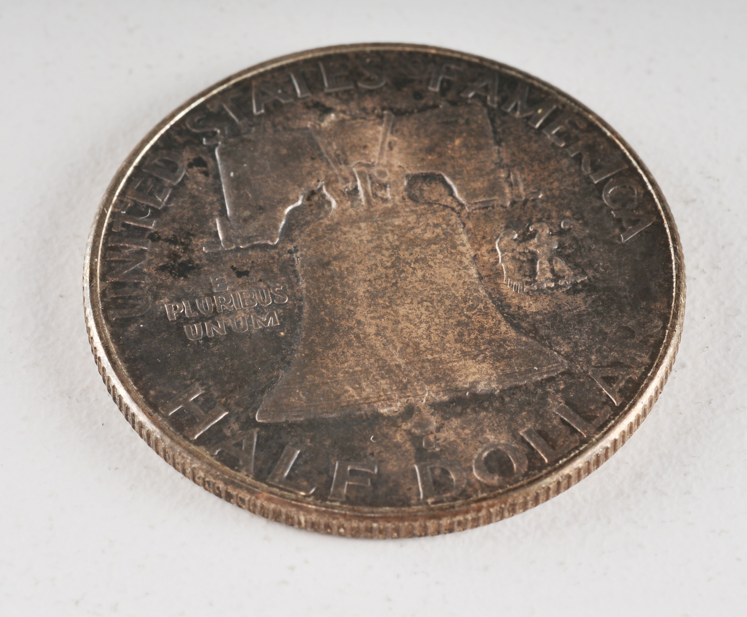 Group of (4) Franklin silver half dollars including the following: (2) 1952 D, (1) 1953 D, and (1) 1955