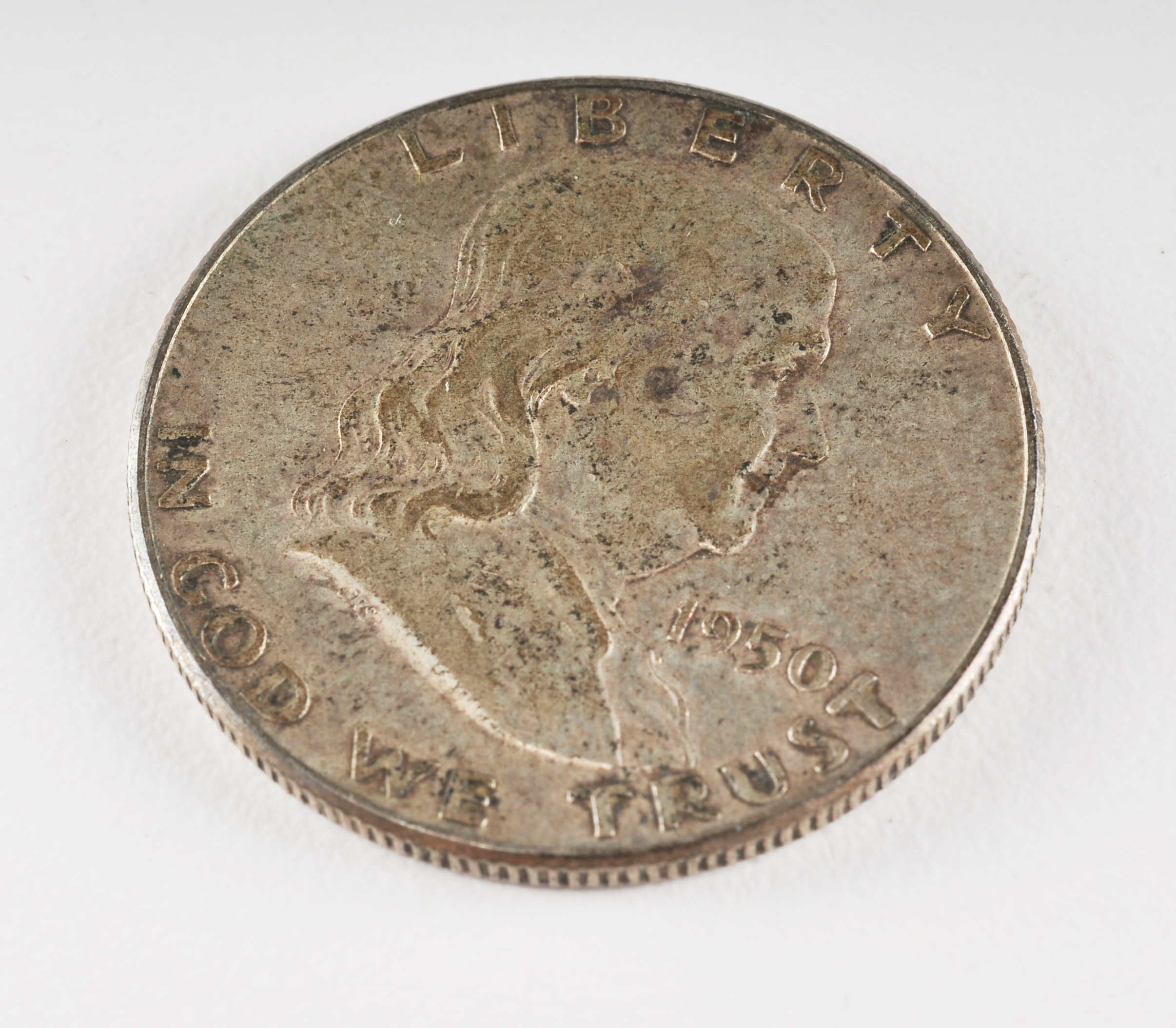 Group of (4) Franklin silver half dollars including the following: (2) 1949 S, and (2) 1950