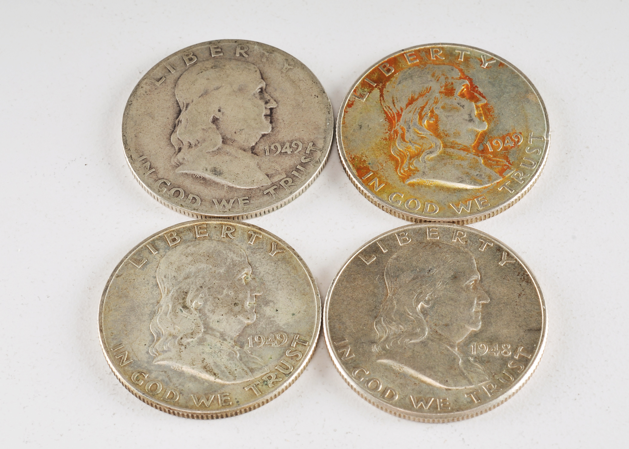 Group of (4) Franklin silver half dollars including the following: (1) 1948 D, (2) 1949 D, and (1) 1949 S