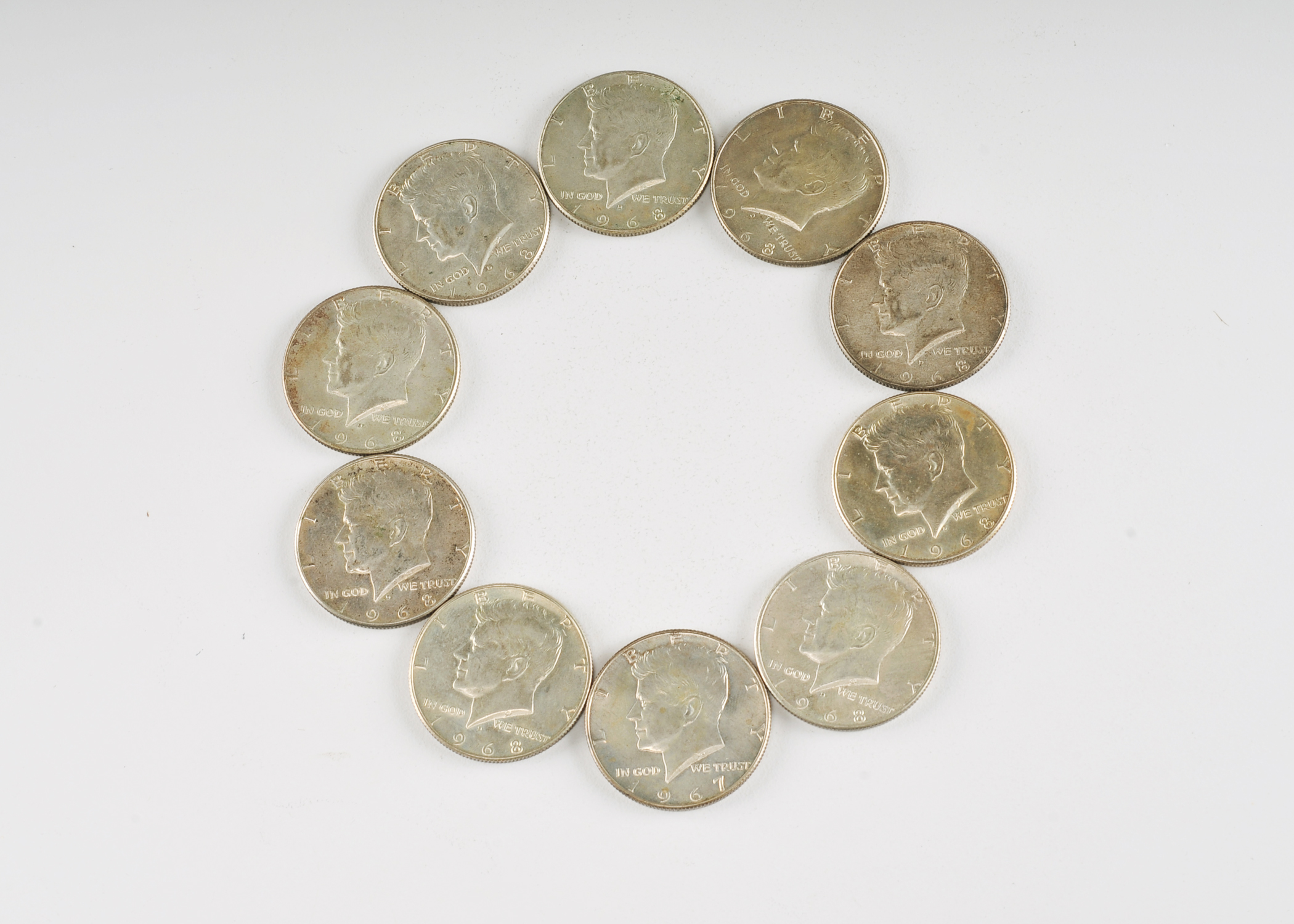 Group of (10) JFK silver clad half dollars including the following: (1) 1967, and (9) 1968 D