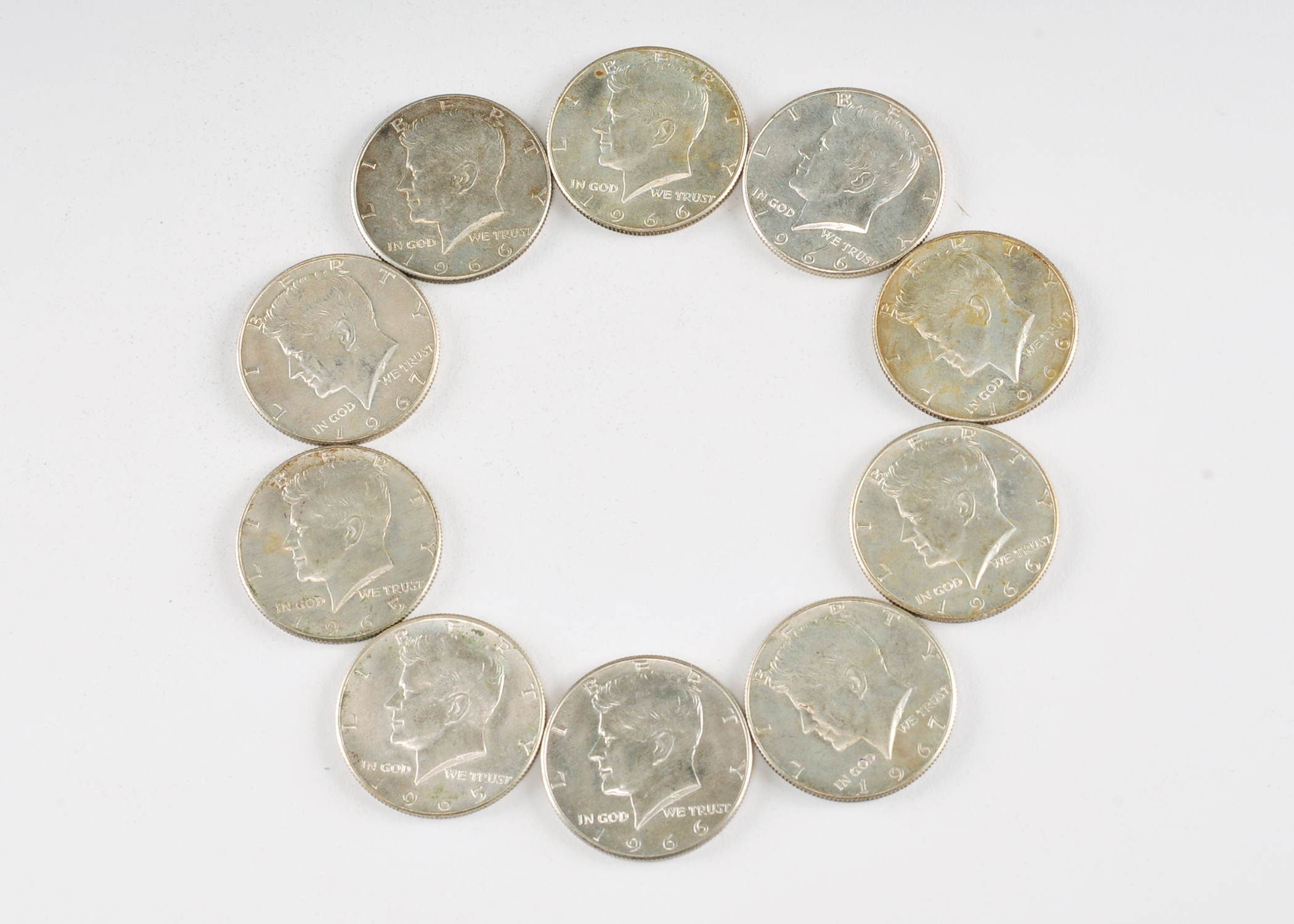 Group of (10) JFK silver clad half dollars including the following: (2) 1965, (6) 1966, and (2) 1967