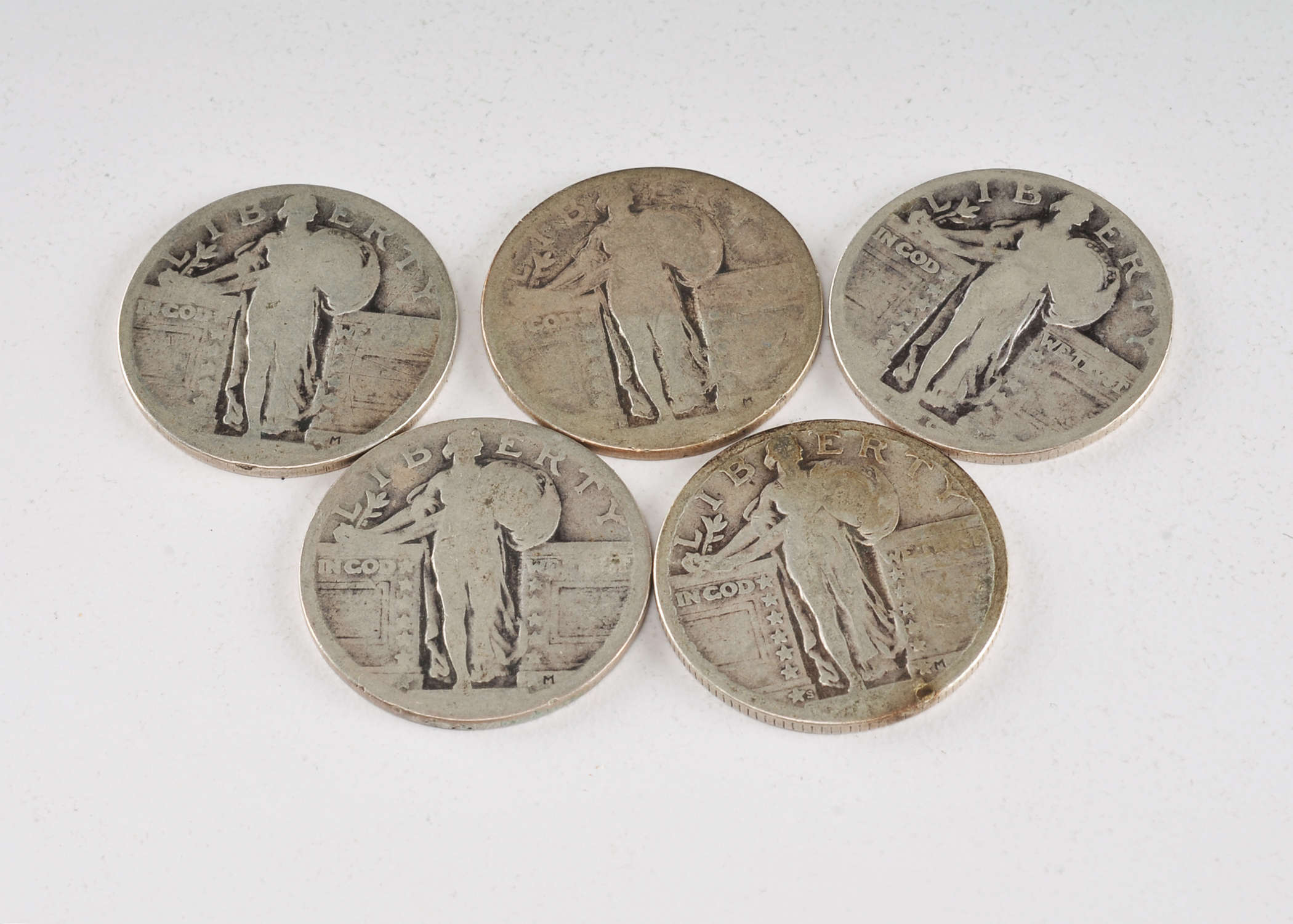 Group of (5) silver Standing Liberty quarters with unreadable dates