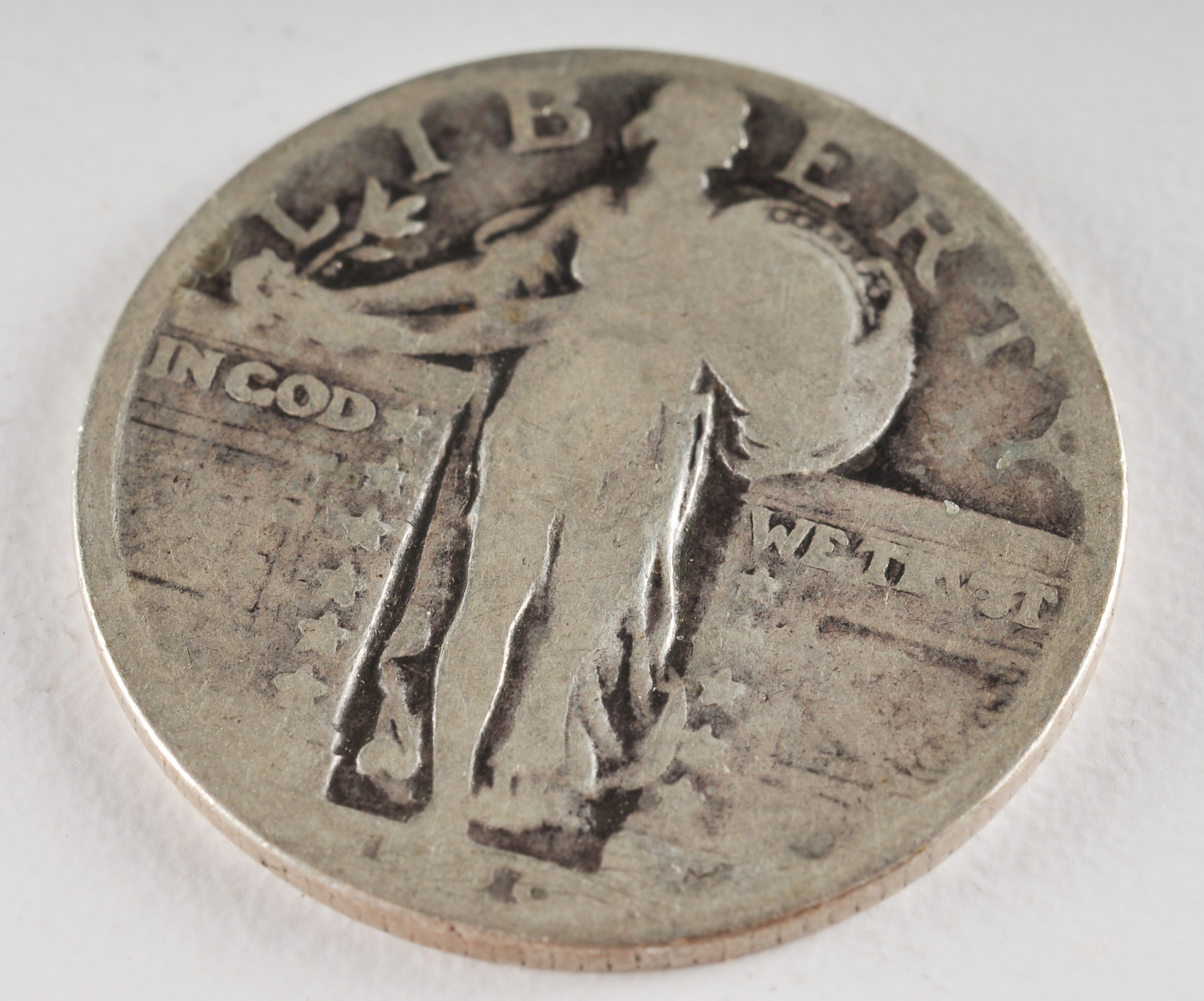 Group of (5) silver Standing Liberty quarters with unreadable dates