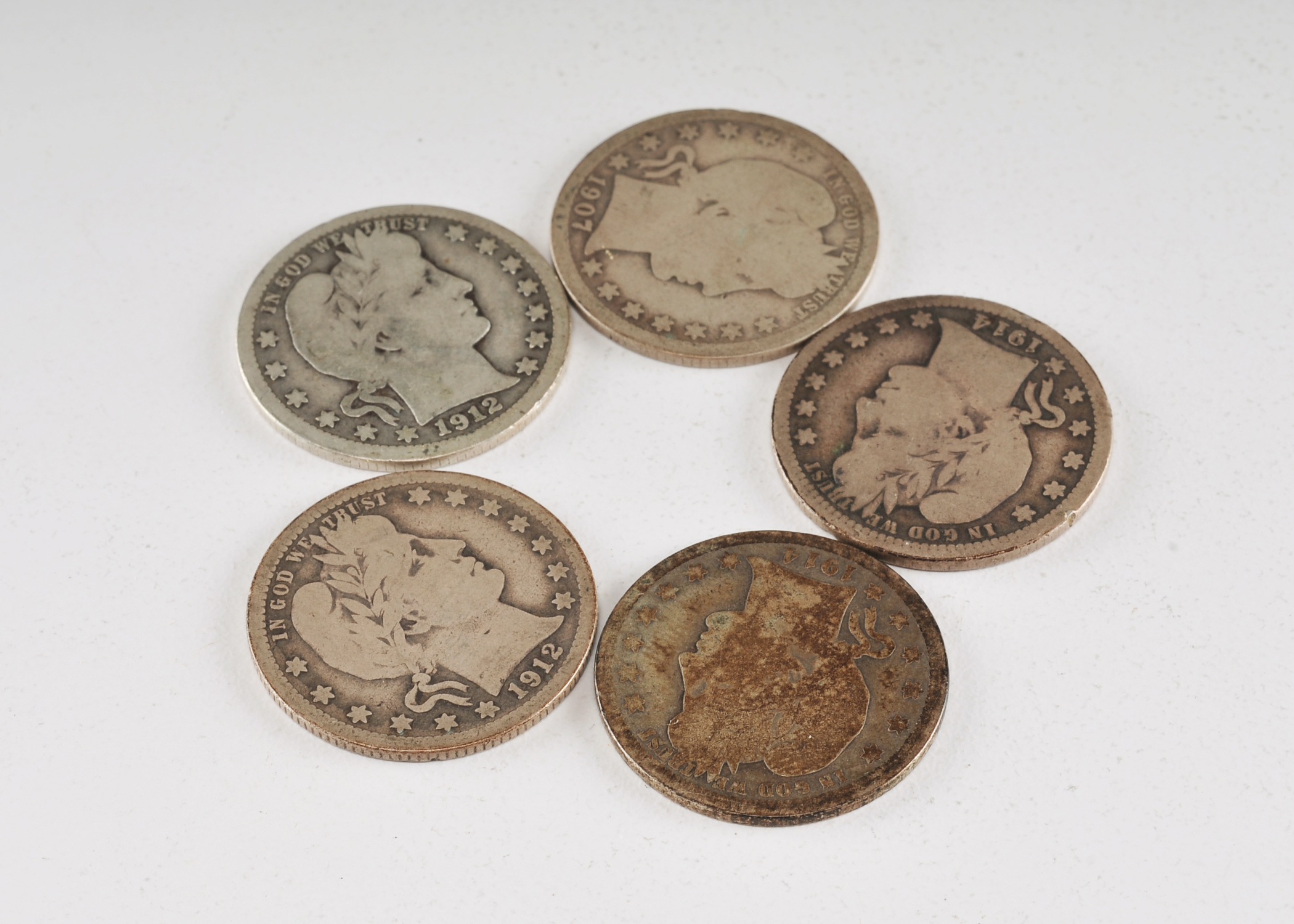 Group of (5) silver Barber quarters including the following: 1907, 1912, 1912 S, 1914, and 1914 D