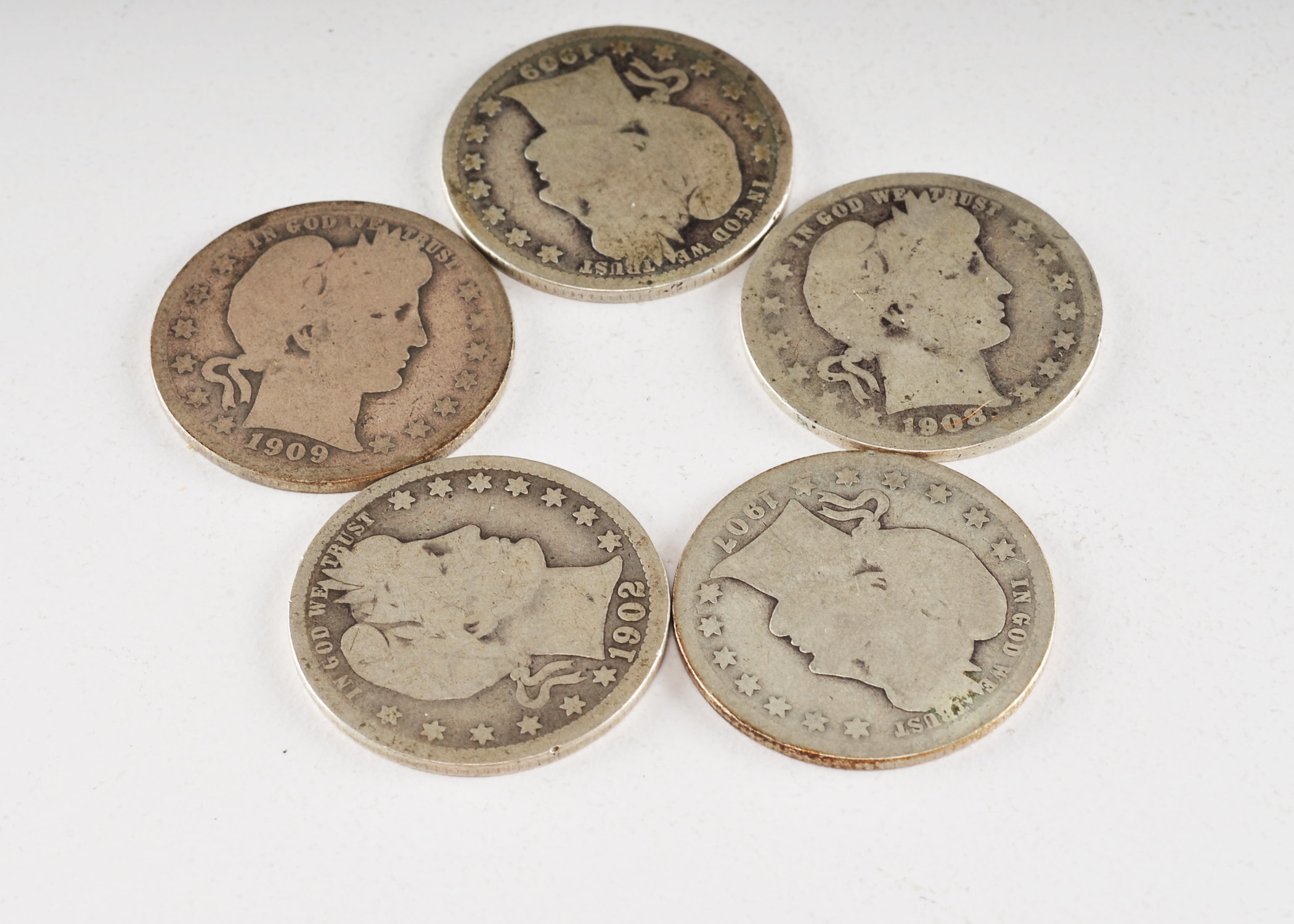 Group of (5) silver Barber quarters including the following: 1902, 1907, 1908 D, 1909, and 1909 D