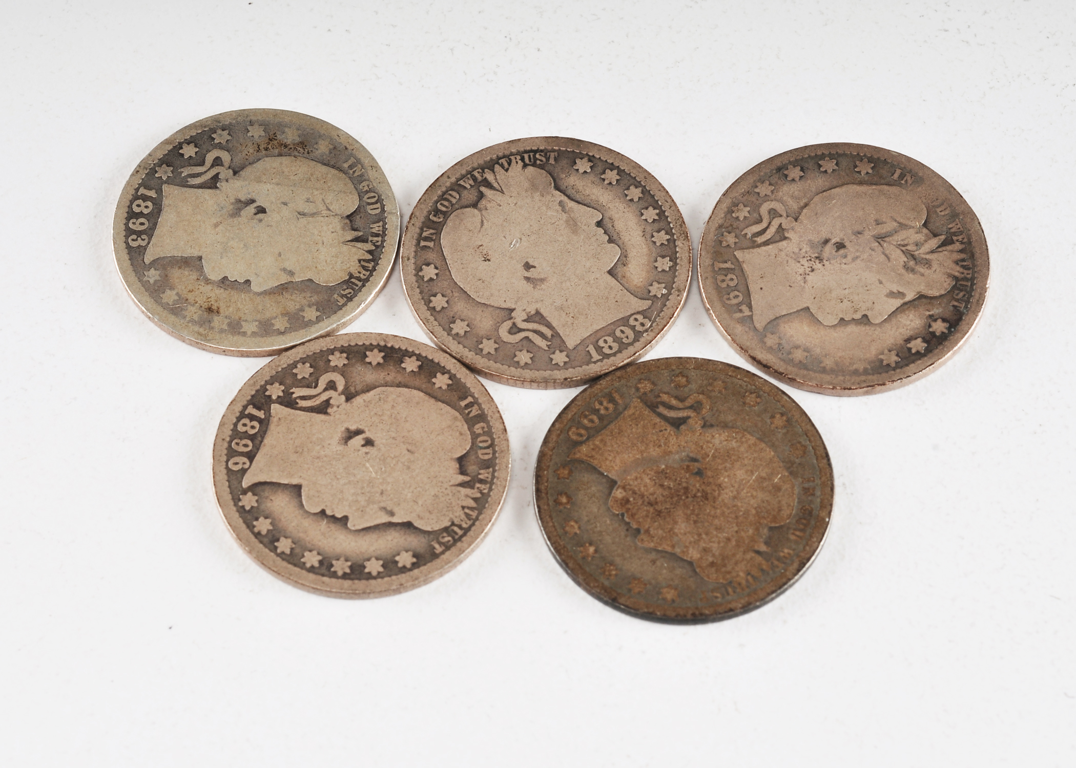 Group of (5) silver Barber quarters including the following: 1893, 1896, 1897, 1898, and 1899
