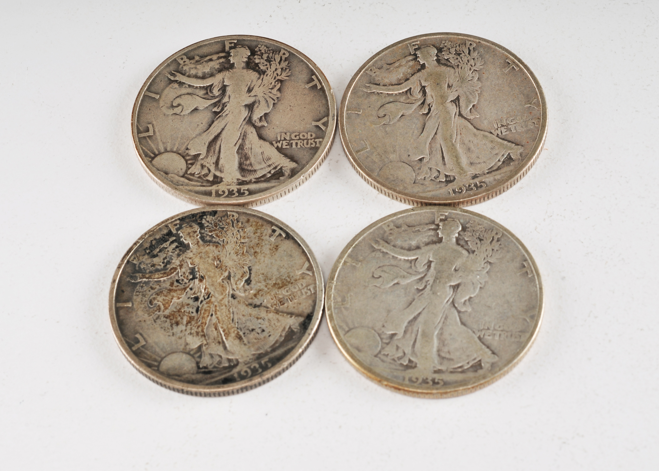 Group of (4) Walking Liberty silver half dollars including the following: (2) 1935 and (2) 1935 D