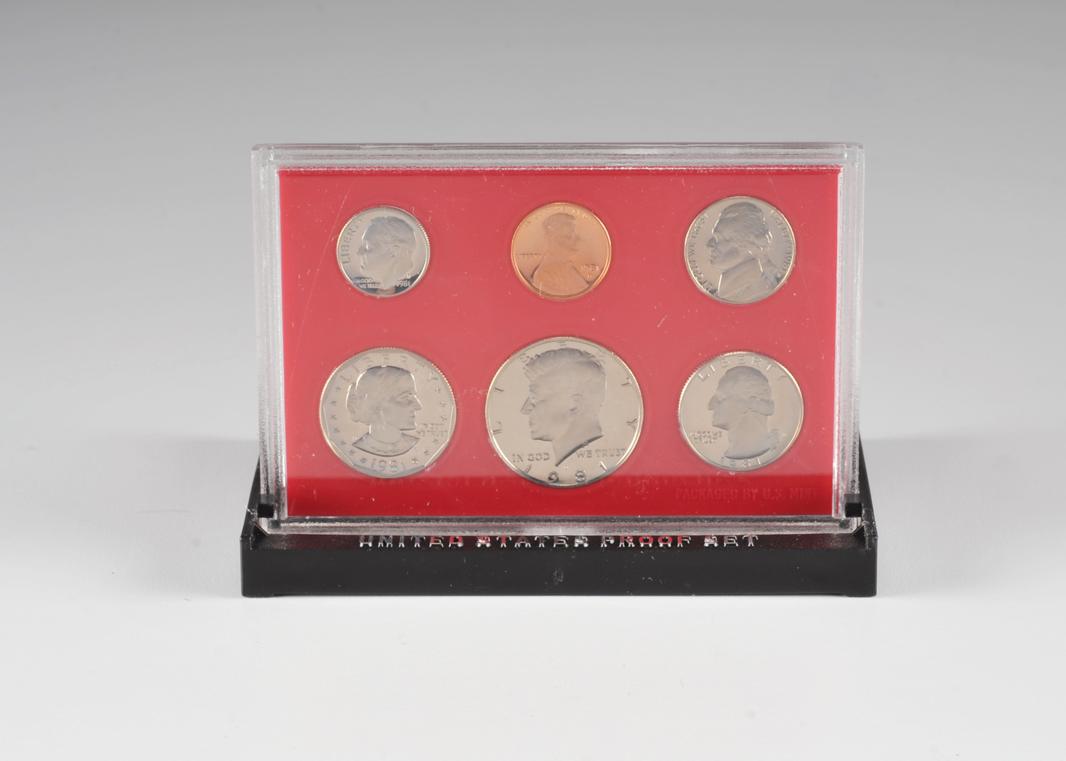 1981 United States proof set including Susan B. Anthony dollar, JFK half dollar, Washington quarter, Roosevelt dime, Jefferson nickel, and Lincoln penny