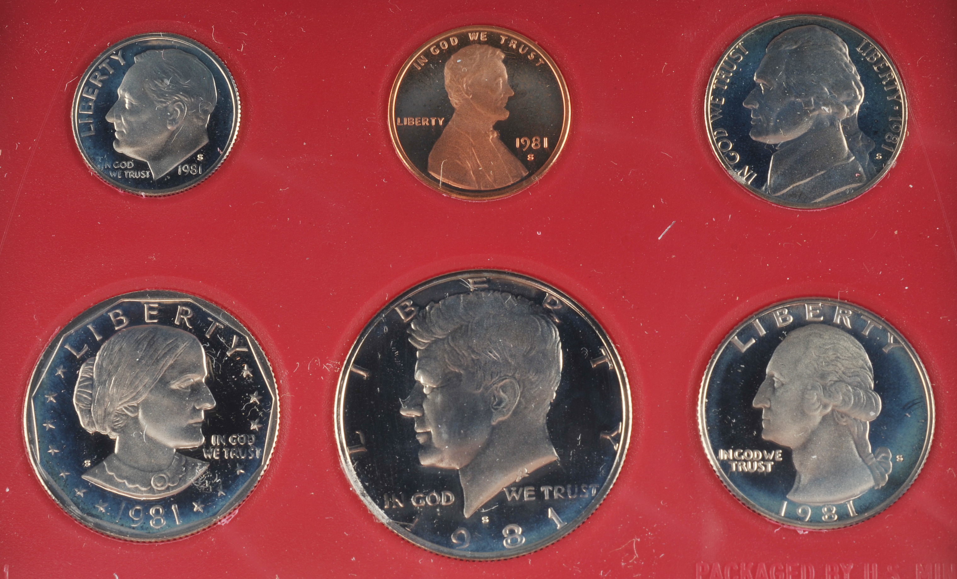1981 United States proof set including Susan B. Anthony dollar, JFK half dollar, Washington quarter, Roosevelt dime, Jefferson nickel, and Lincoln penny