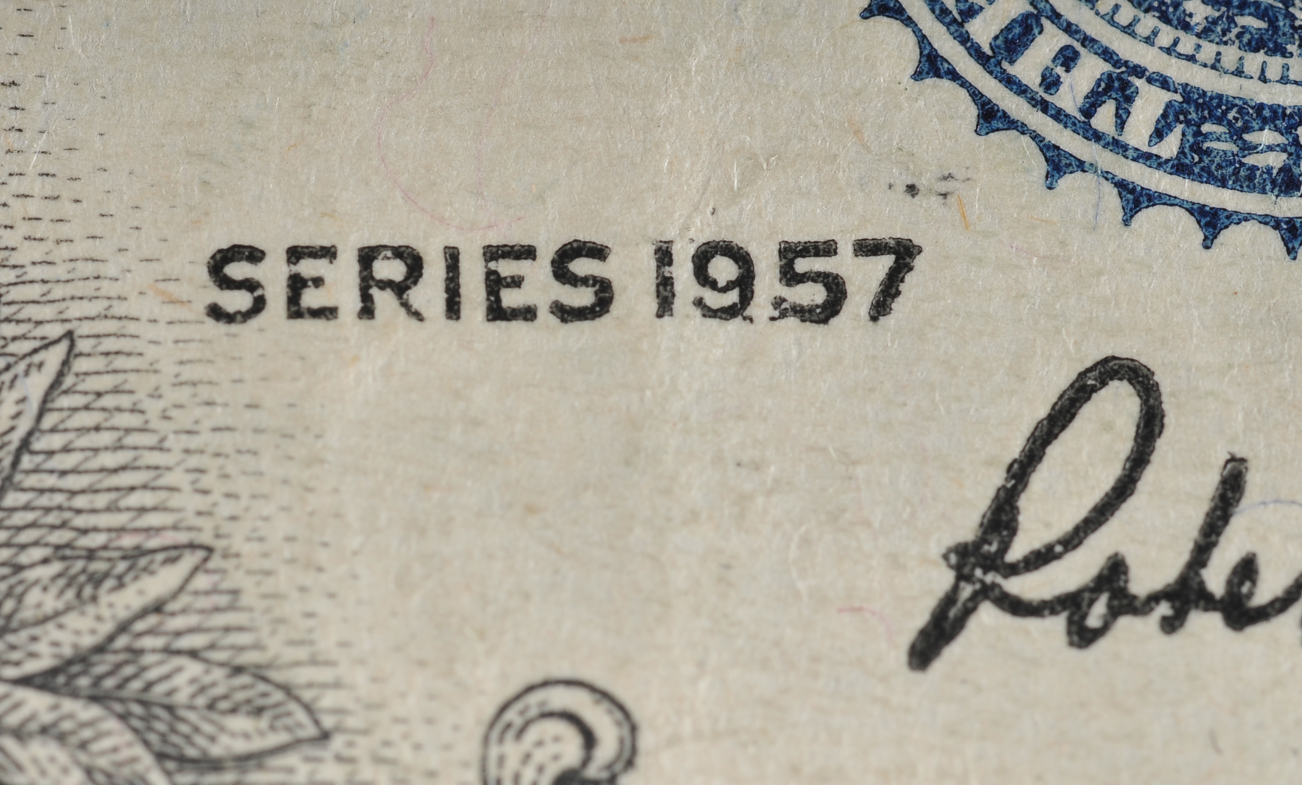 1957 One Dollar silver certificate with blue seal with star in the serial number