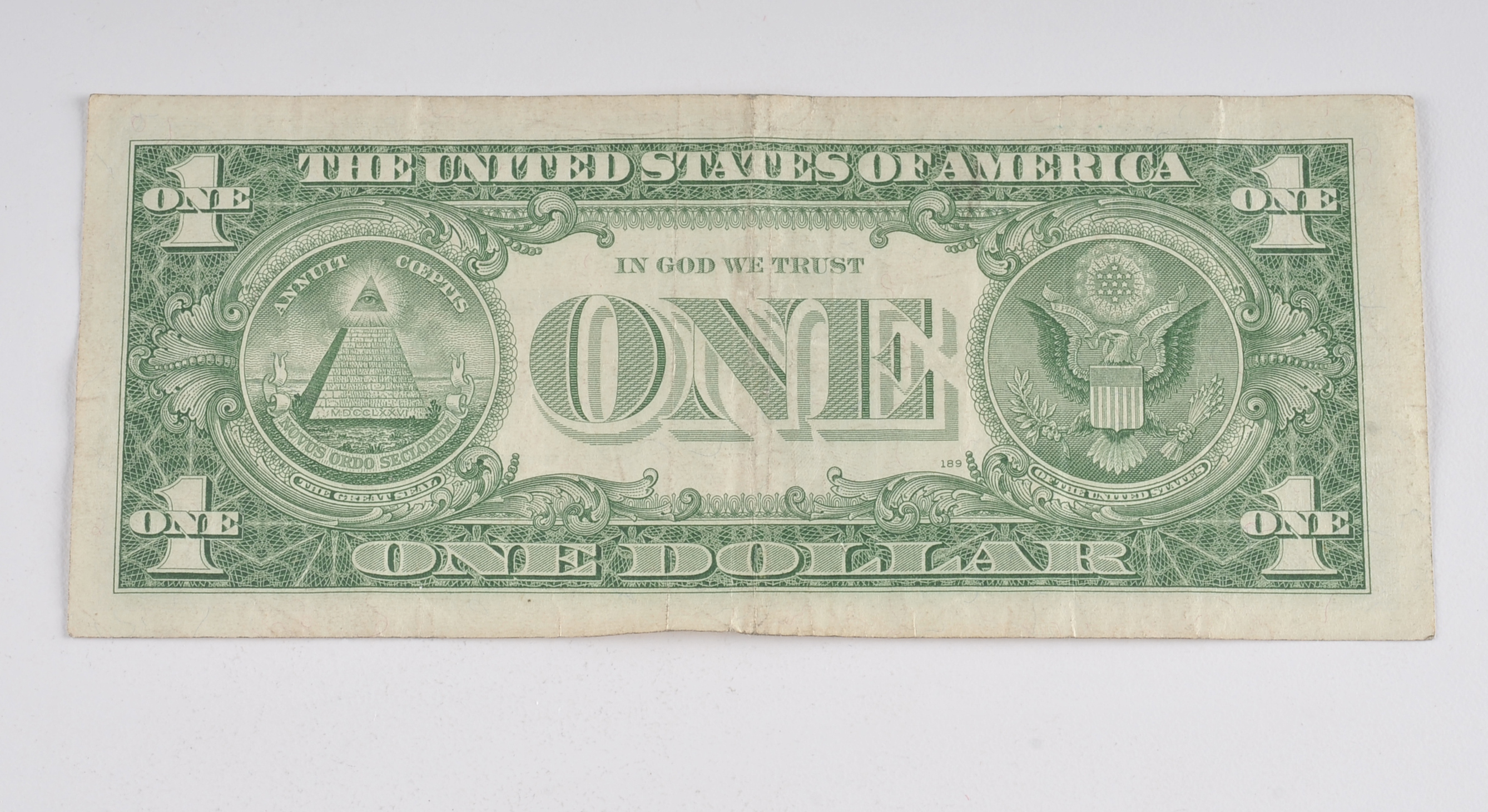 1957 One Dollar silver certificate with blue seal with star in the serial number