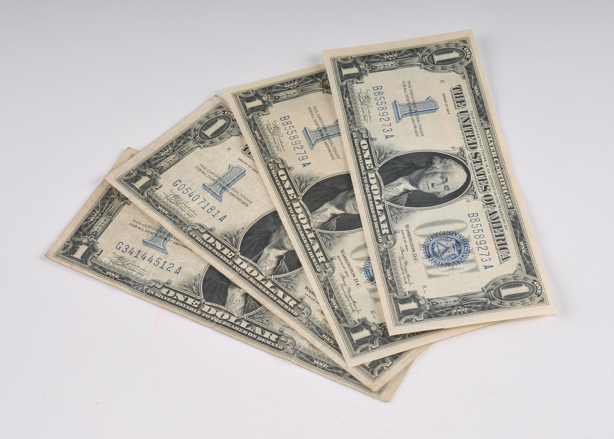 Group of (4) 1934 Blue seal one dollar silver certificates