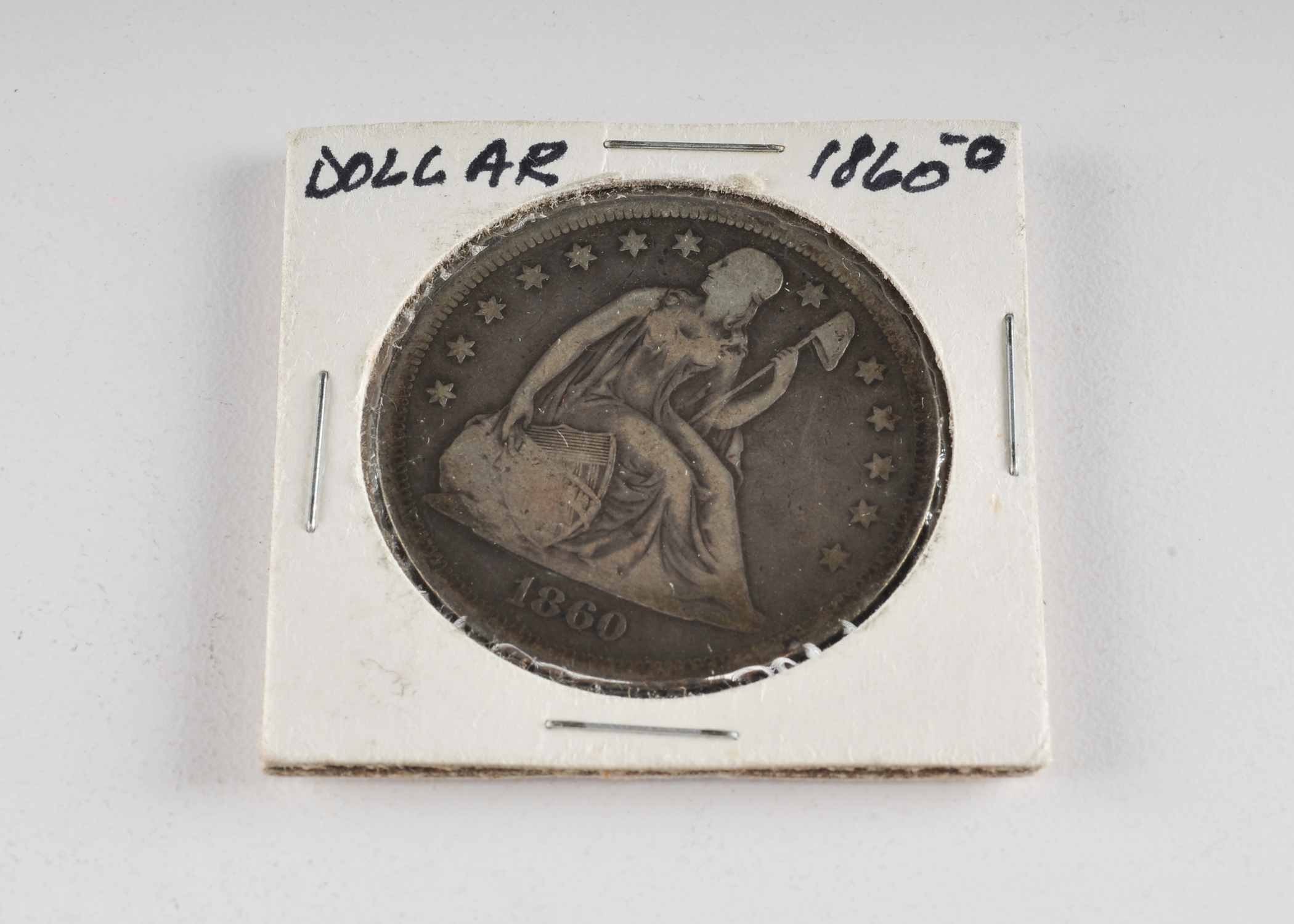 1860 O Liberty Seated silver dollar