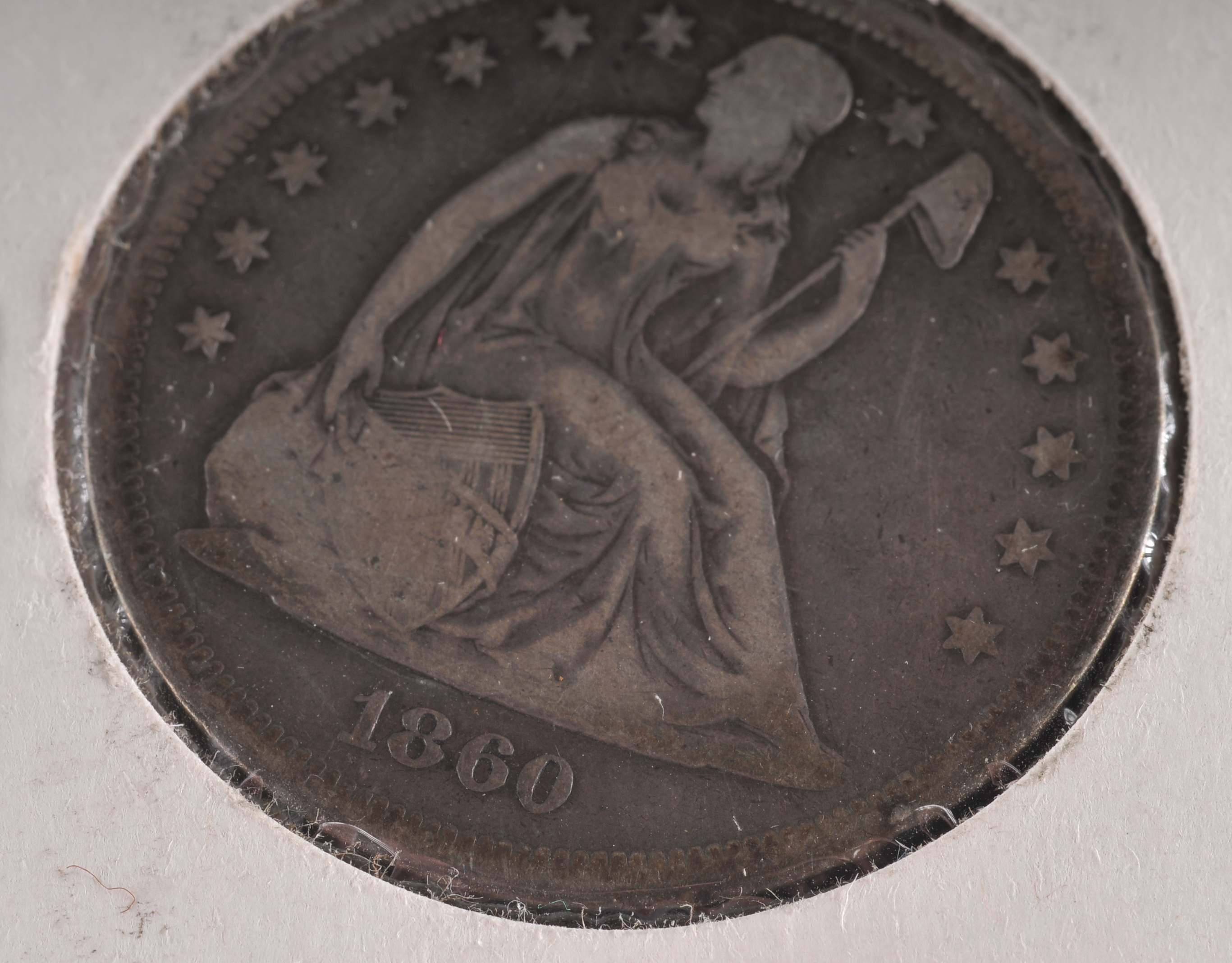 1860 O Liberty Seated silver dollar