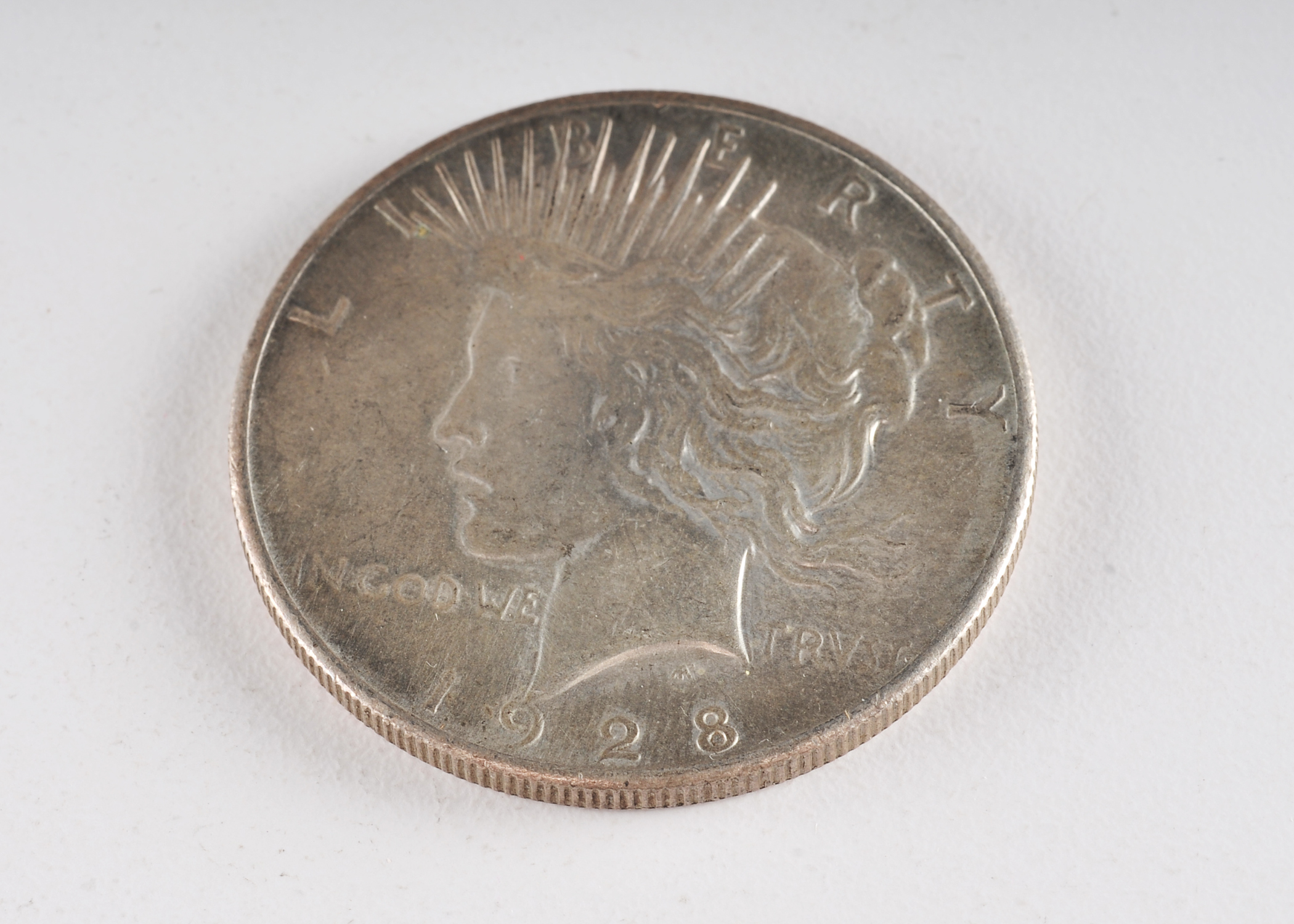 Low mintage Key date 1928 Peace silver dollar