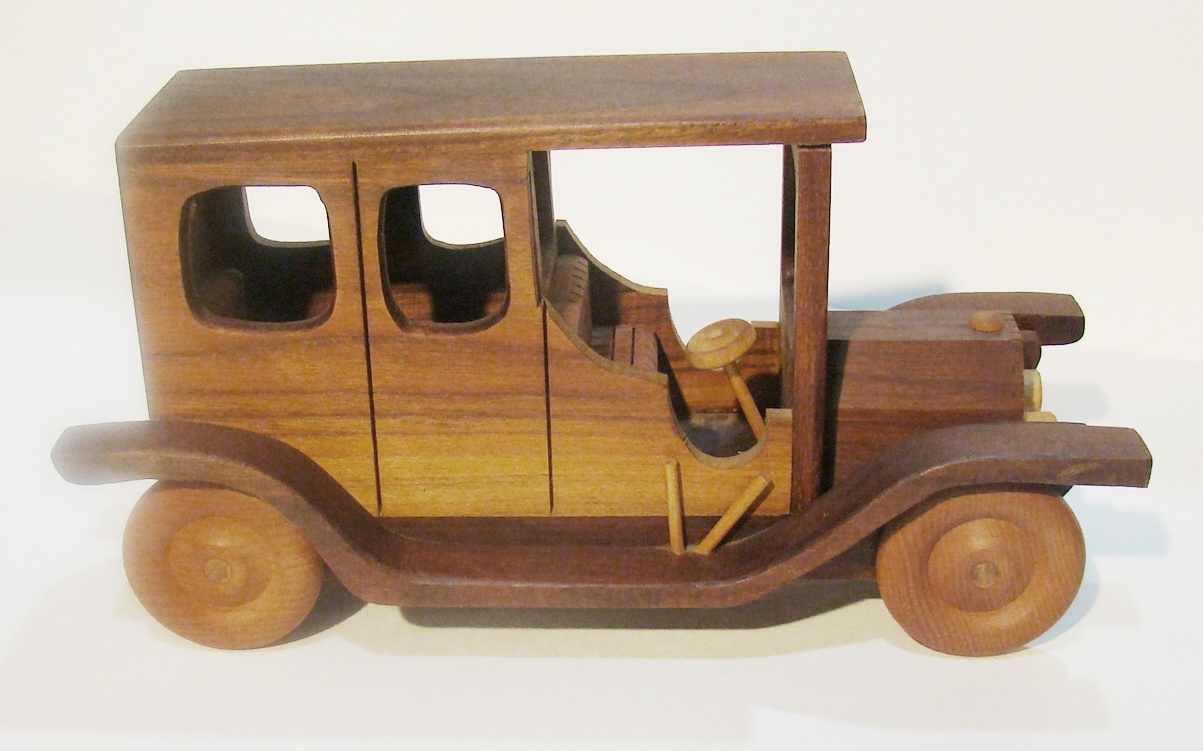 Plants n Planks vintage wooden car. 