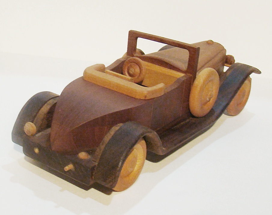 Plants n Planks vintage wooden car. 