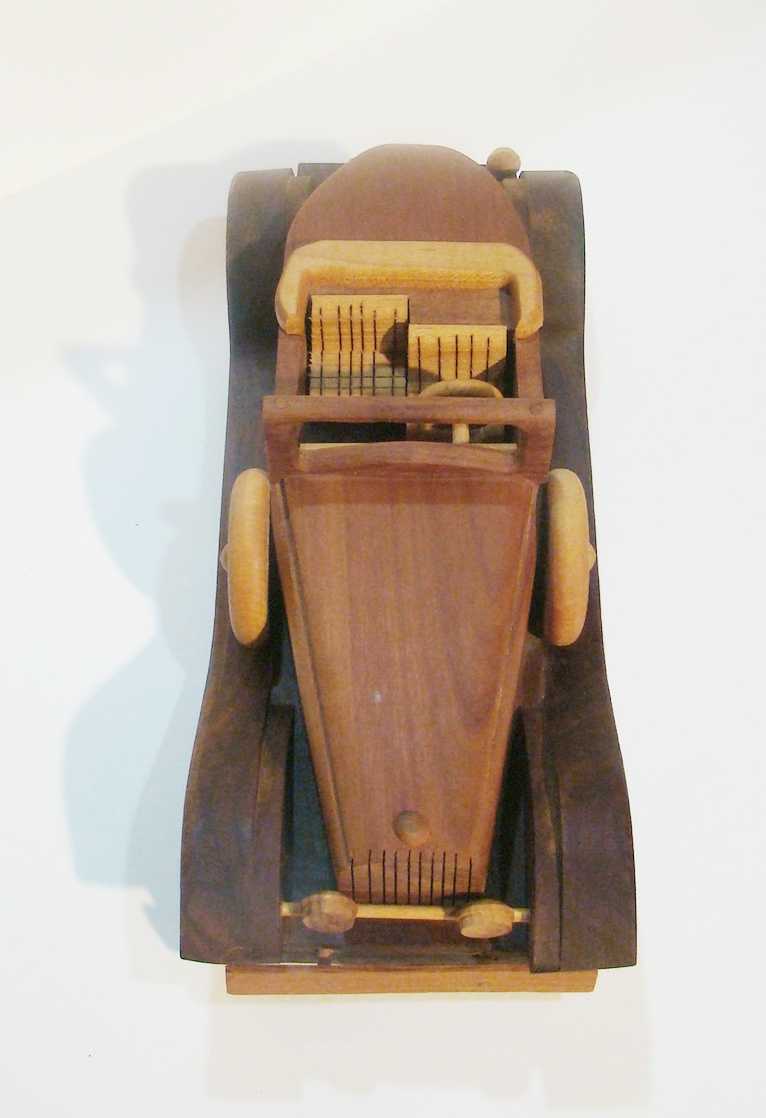 Plants n Planks vintage wooden car. 