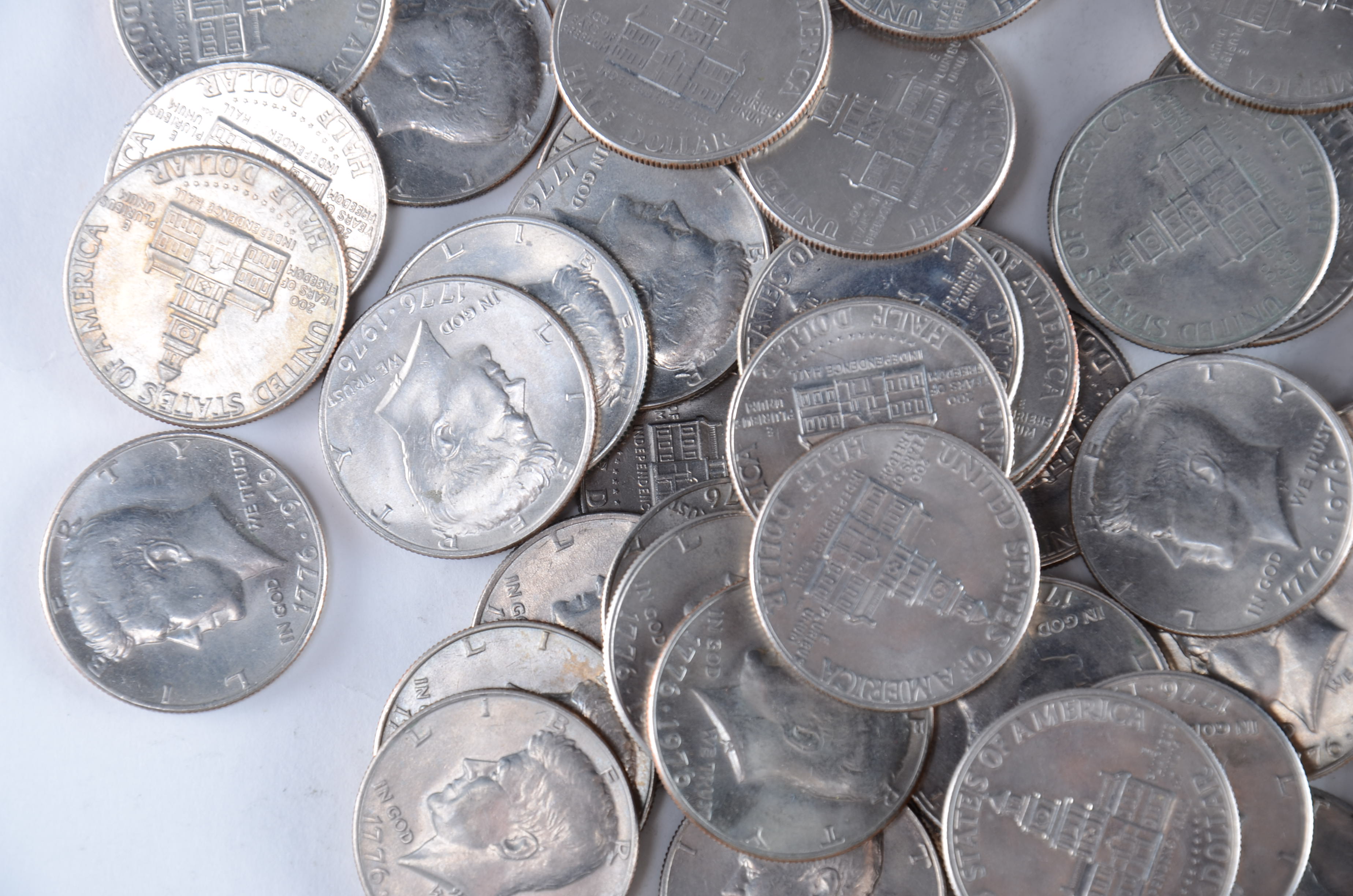 Group of (64) 1976 JFK Bicentennial Half dollars including the following: (47) from the Philadelphia mint and (17) from the Denver mint