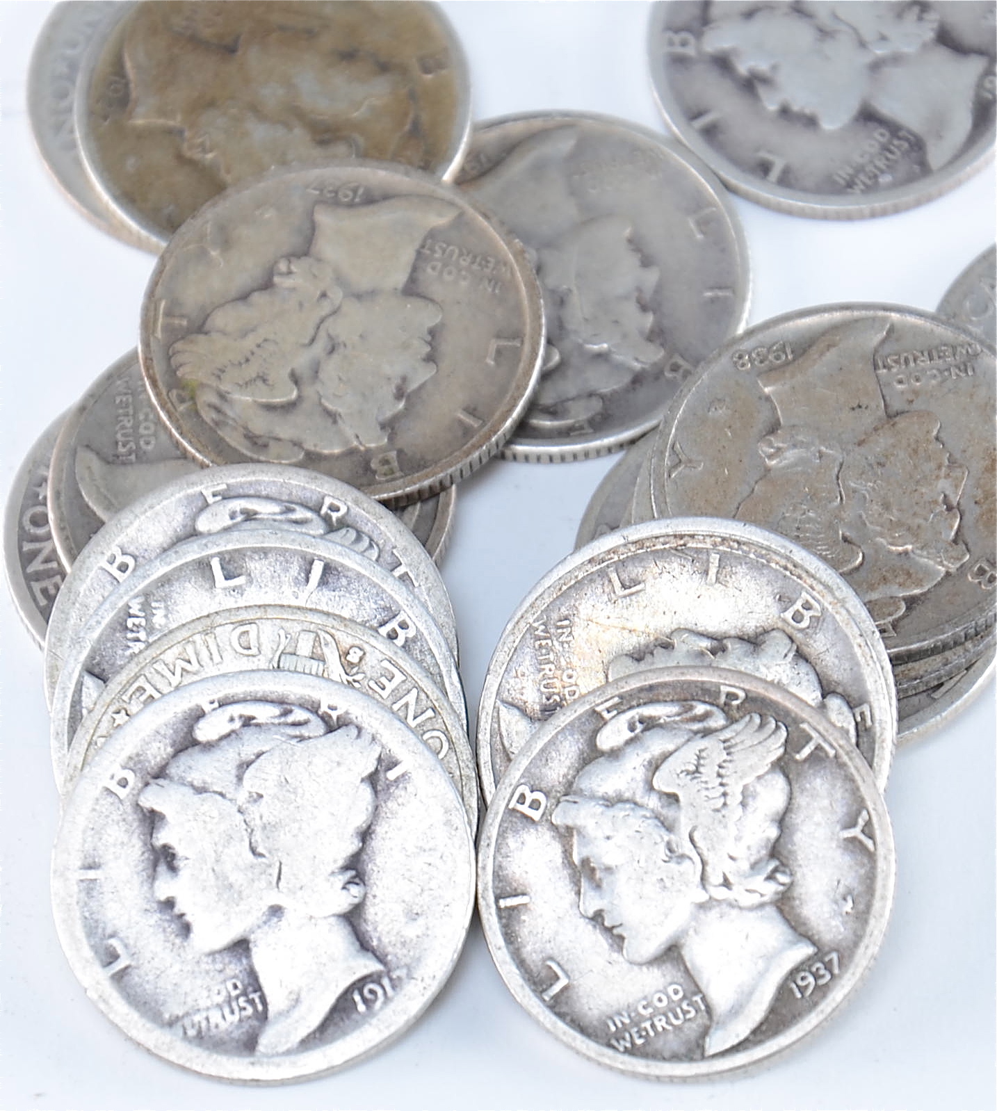 Group of (20) silver Mercury dimes including the following: 1917, 1920, 1923, 1927, 1928, 1929, 1934, 1934 D, 1935, 1935 D, 1935 S, 1936, 1936 D, 1936 S, 1937, 1937 D, 1937 S, 1938, 1938 D, and 1938 S
