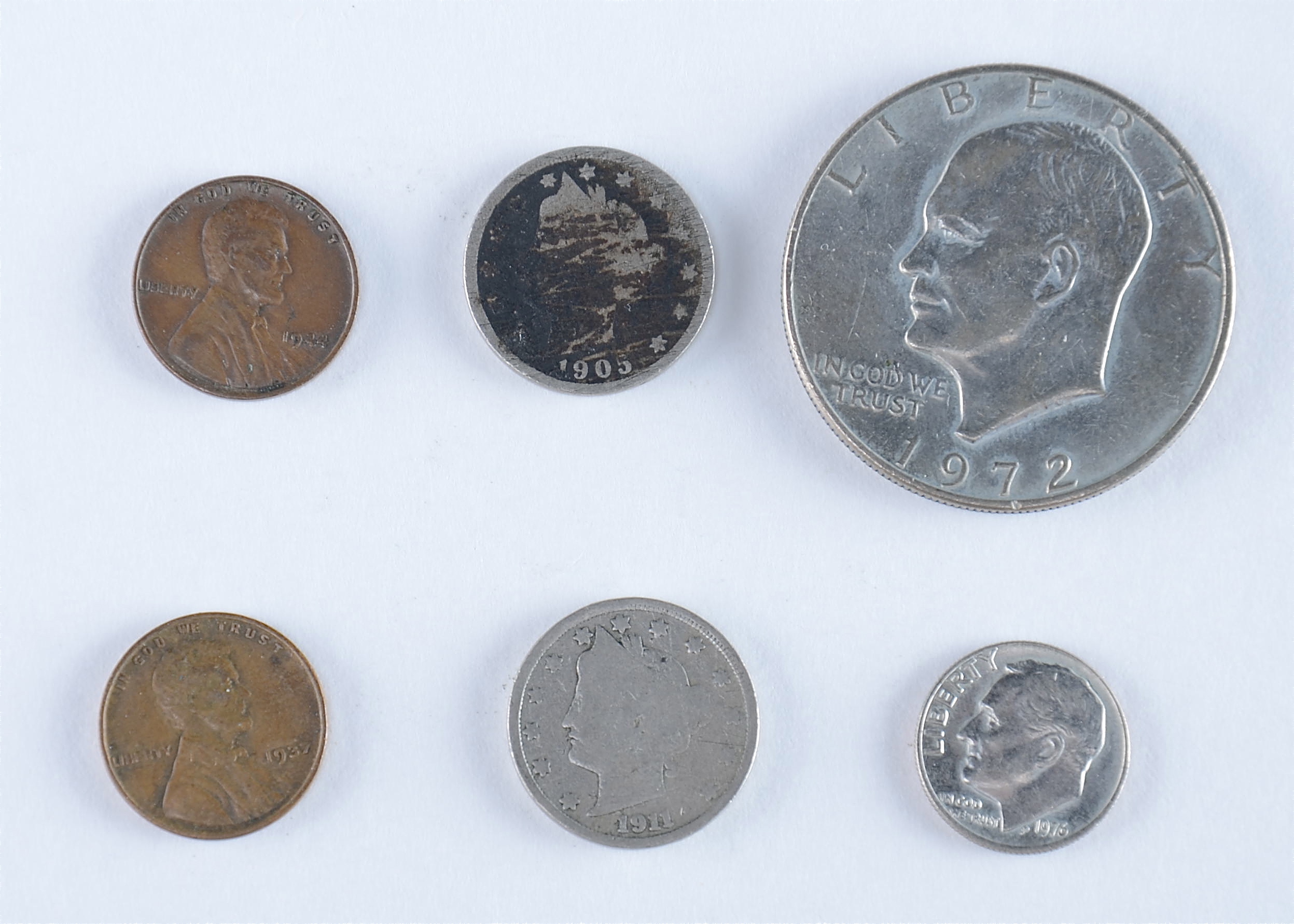 Group of American coins including the following: 1937 and 1944 wheat pennies, 1905 and 1911 Liberty nickels, 1976 Roosevelt dime, and a 1972 Eisenhower dollar1938 S, 1939, 1939 D, and 1939 S