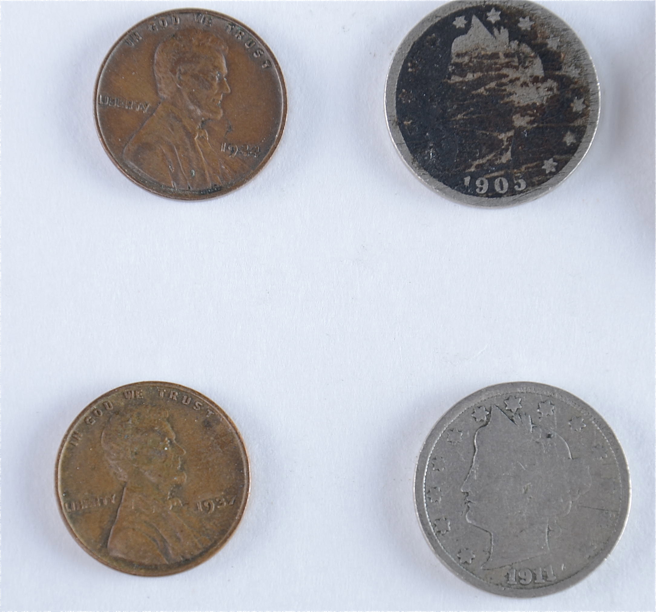 Group of American coins including the following: 1937 and 1944 wheat pennies, 1905 and 1911 Liberty nickels, 1976 Roosevelt dime, and a 1972 Eisenhower dollar1938 S, 1939, 1939 D, and 1939 S