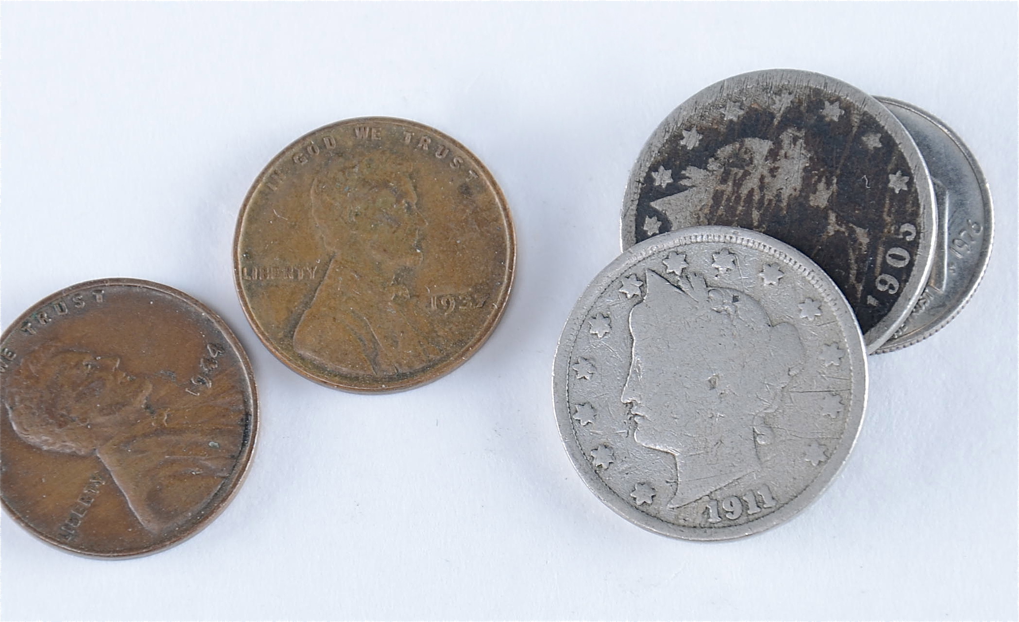 Group of American coins including the following: 1937 and 1944 wheat pennies, 1905 and 1911 Liberty nickels, 1976 Roosevelt dime, and a 1972 Eisenhower dollar1938 S, 1939, 1939 D, and 1939 S