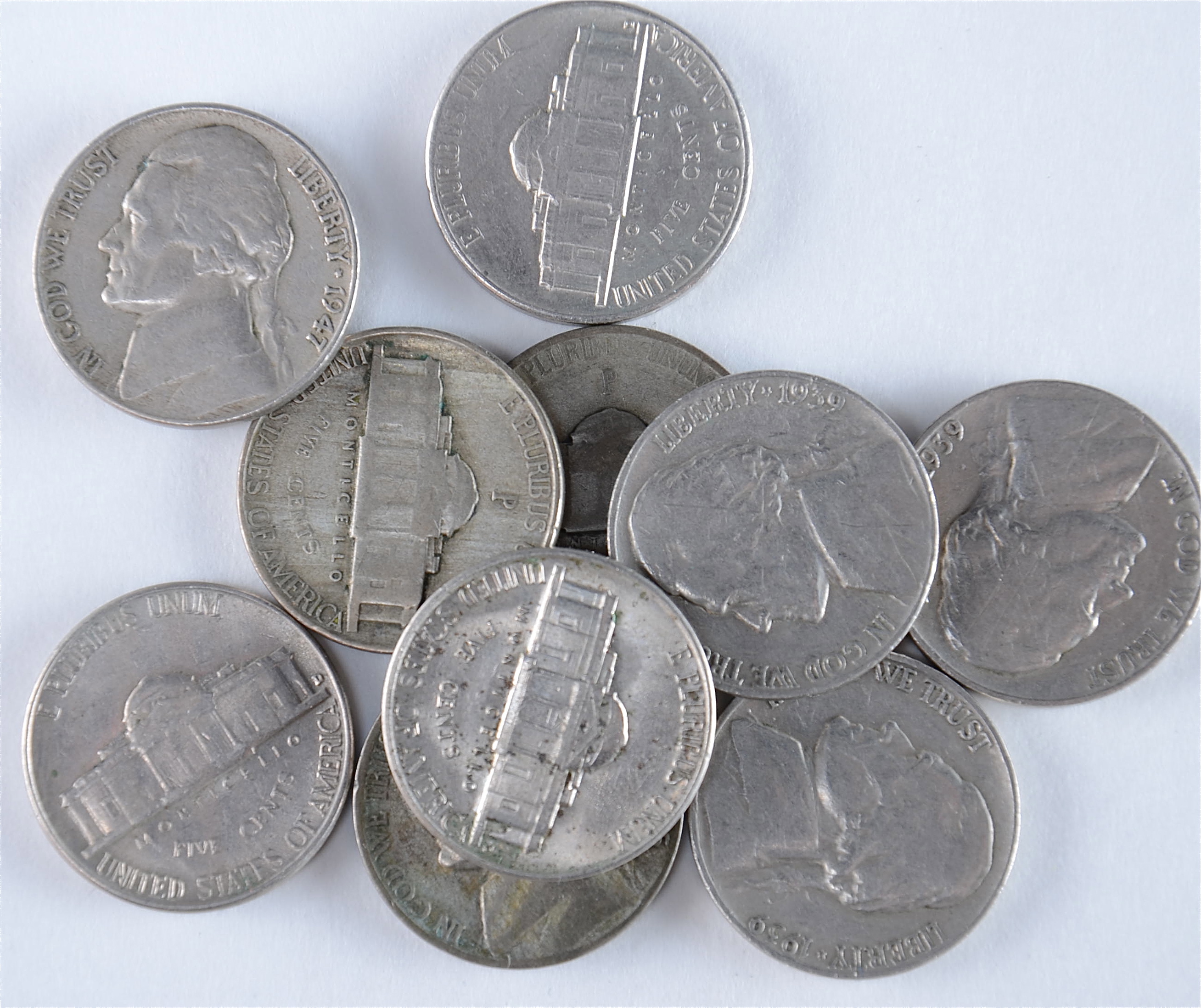 Group of (10) Jefferson nickels including (3) wartime silver nickels. Includes the following: (3) 1939, 1943 P, 1944 P, and 1945 P, 1947, 1956 D, 1957 D, and 1959 D
