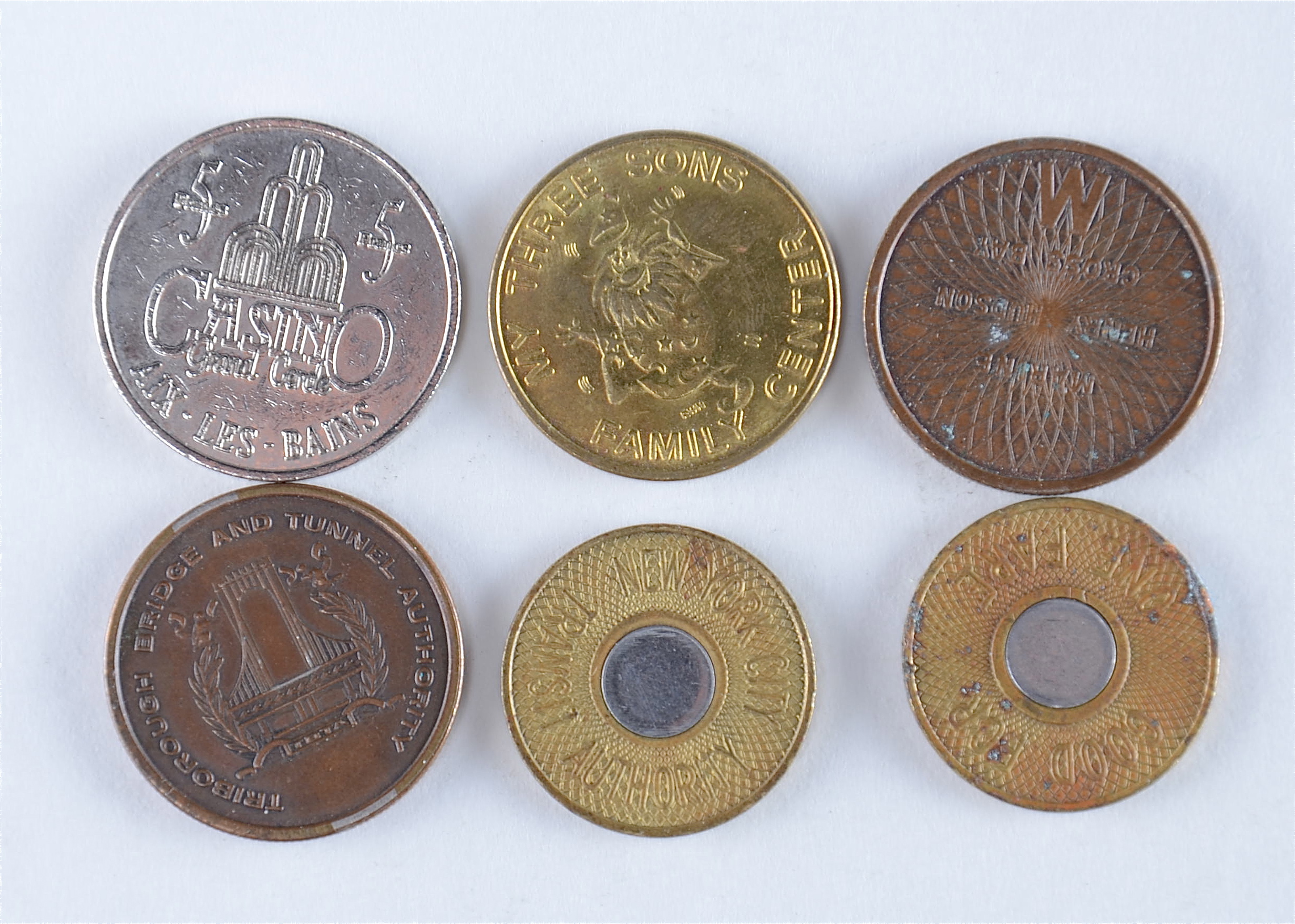 Group of six vintage tokens