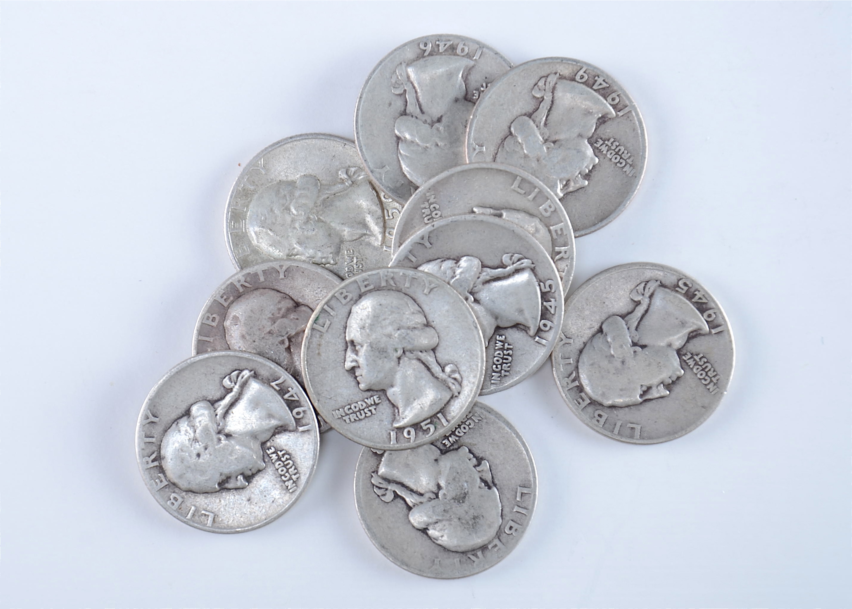 Group of (10) silver Washington quarters including the following: 1942, 1943, 1945, 1945 D, 1945 S, 1946, 1947, 1949, 1950 D, and 1951 D