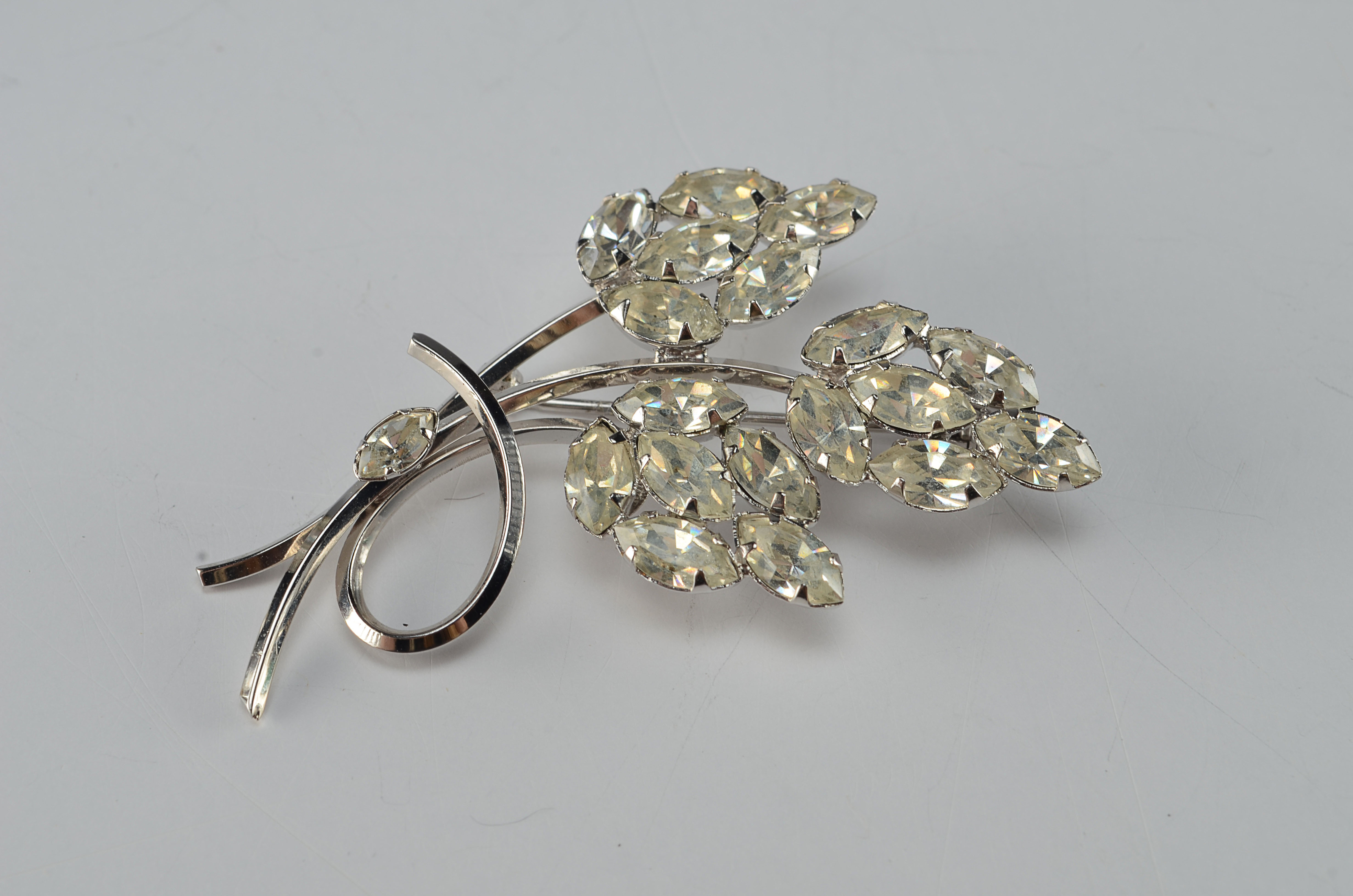 Art sterling silver floral brooch and a pair of "E" signed dangly clip back earrings 