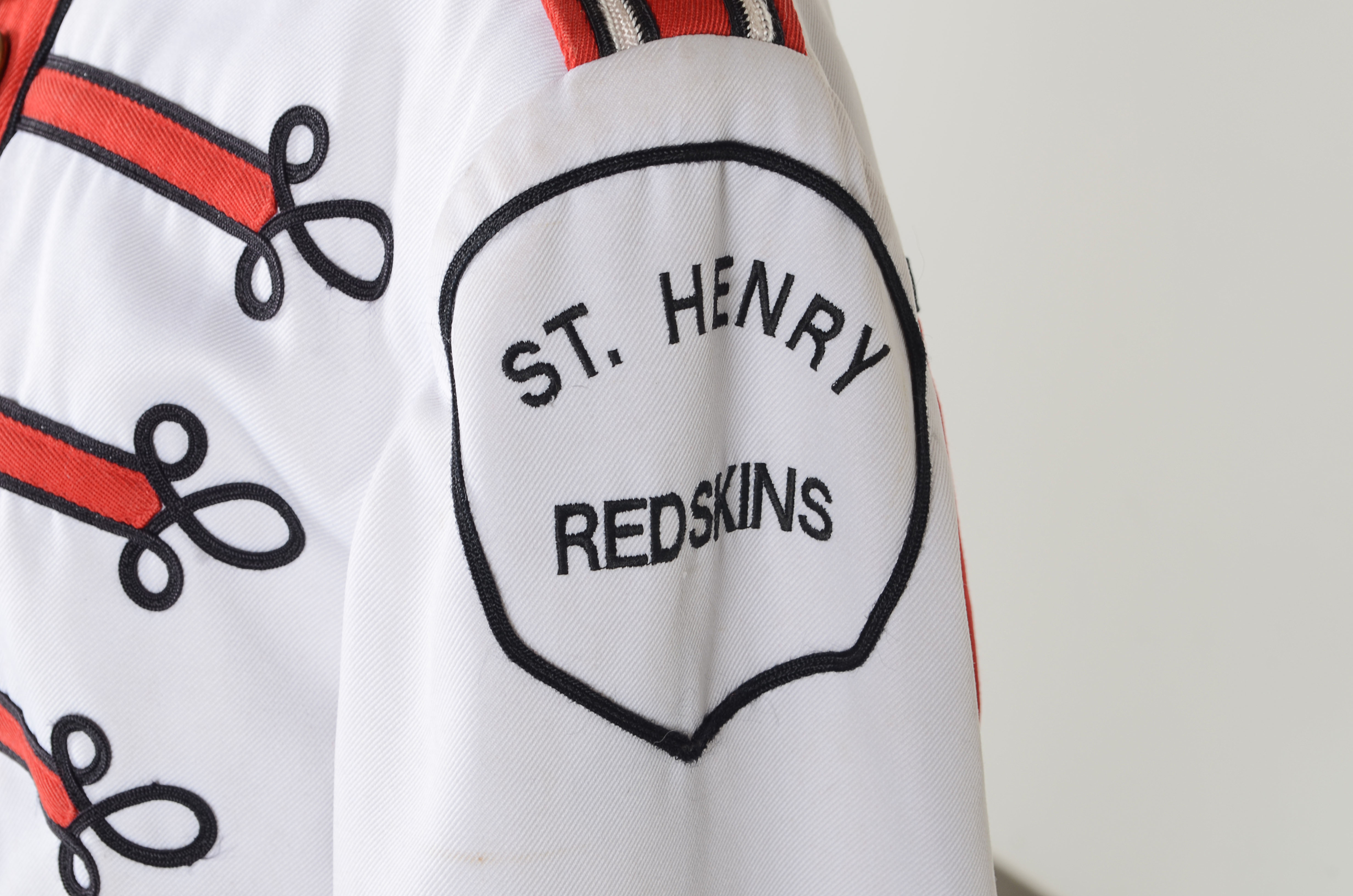 Vintage Muskegon Big Red Band uniform with coordinating hat