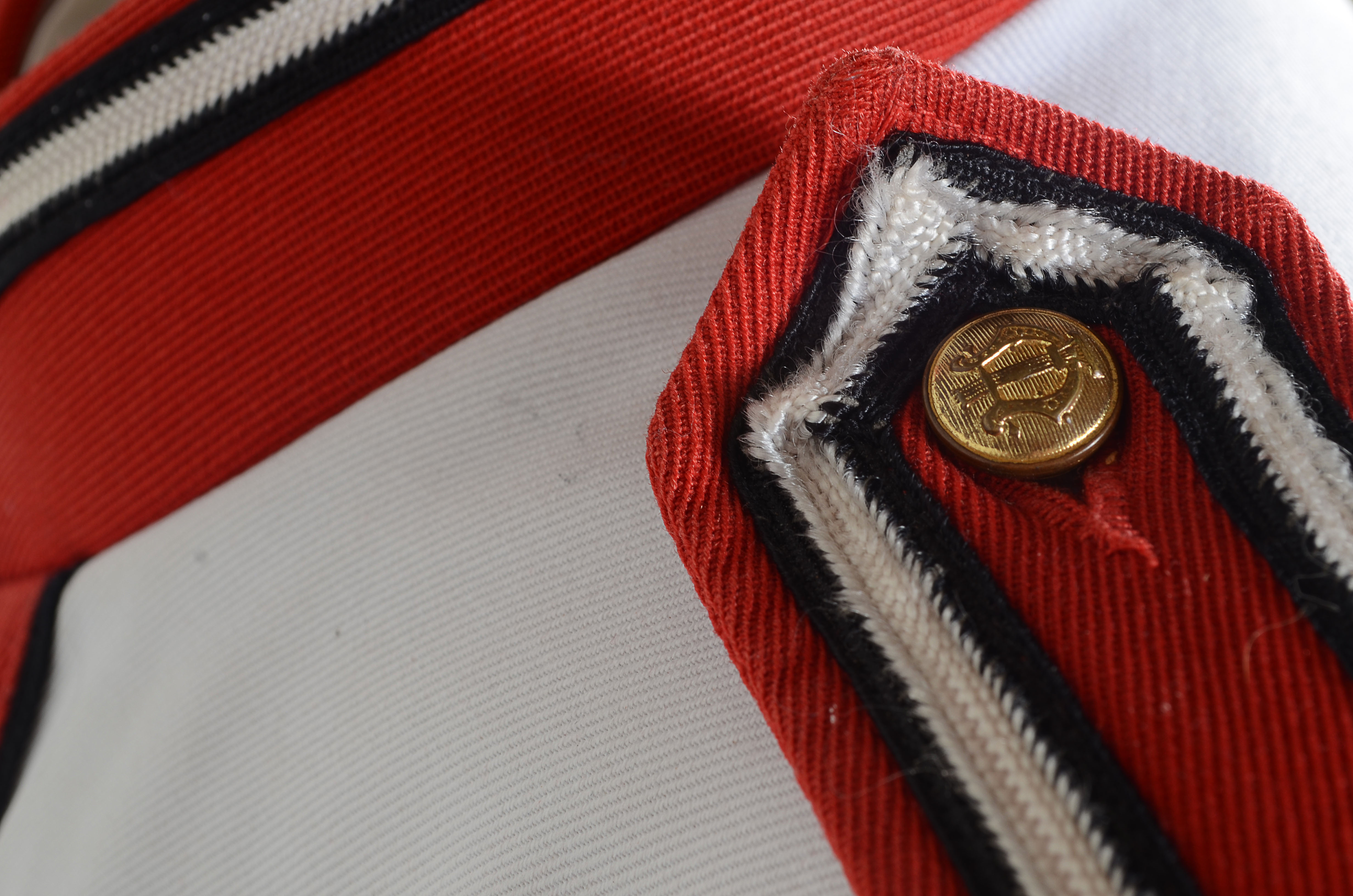 Vintage Muskegon Big Red Band uniform with coordinating hat