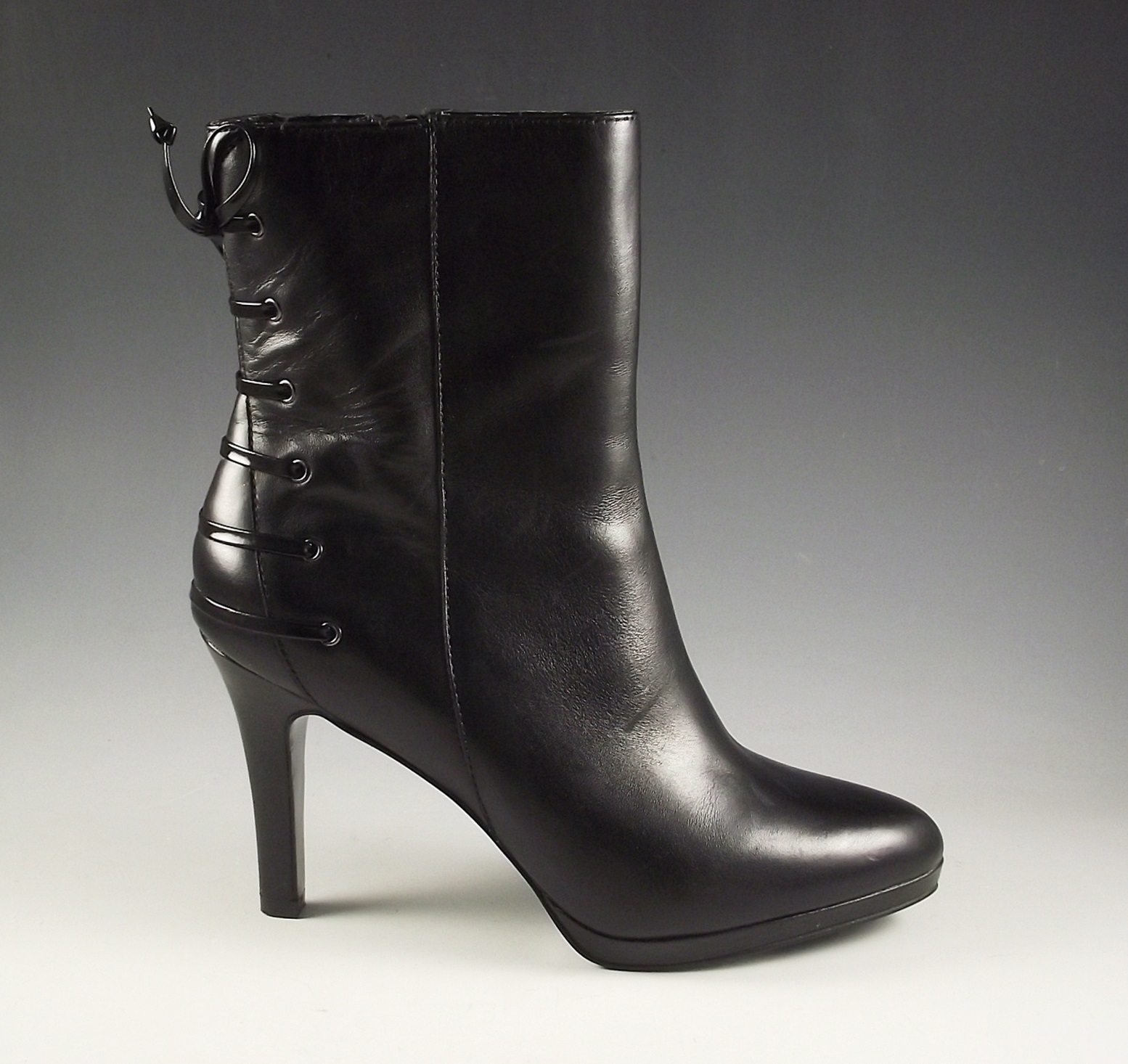 Tahari black leather boots.