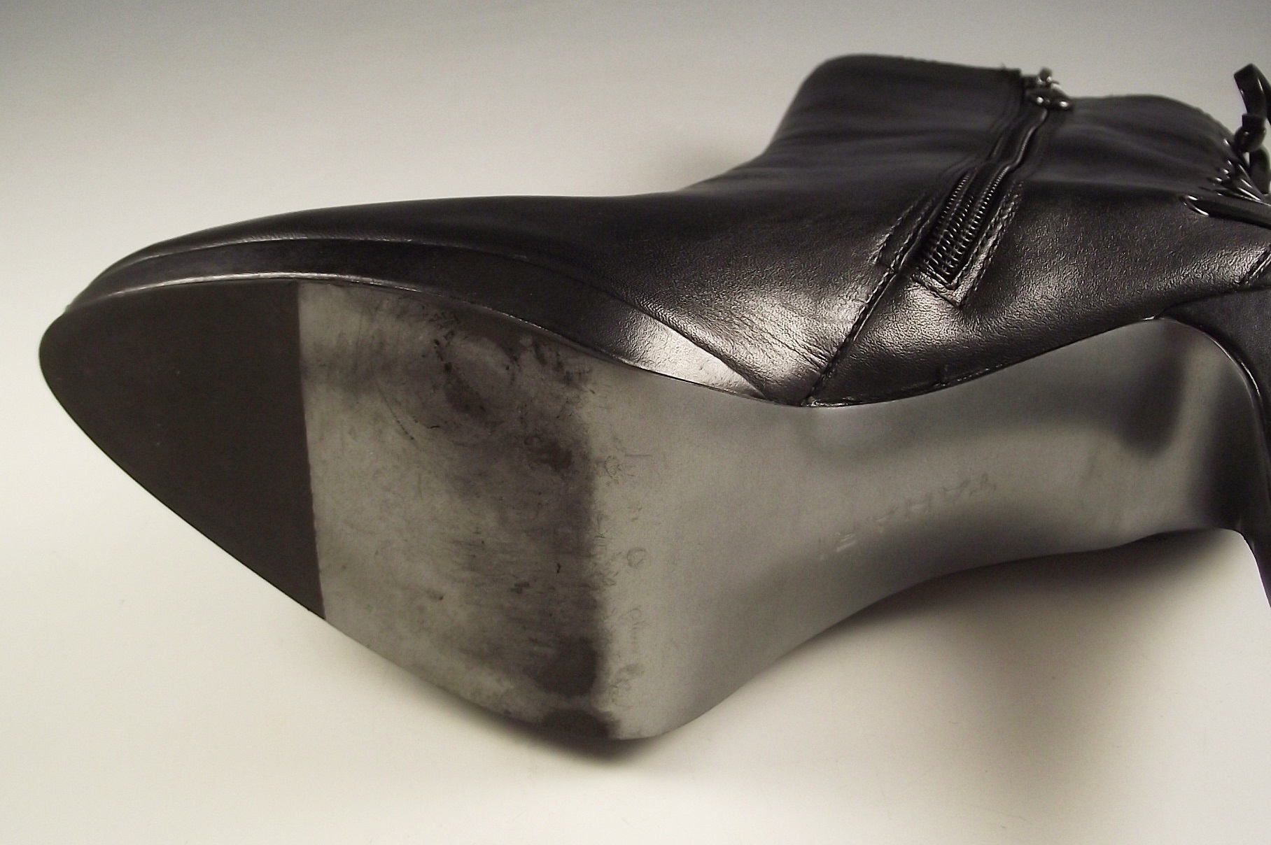 Tahari black leather boots.