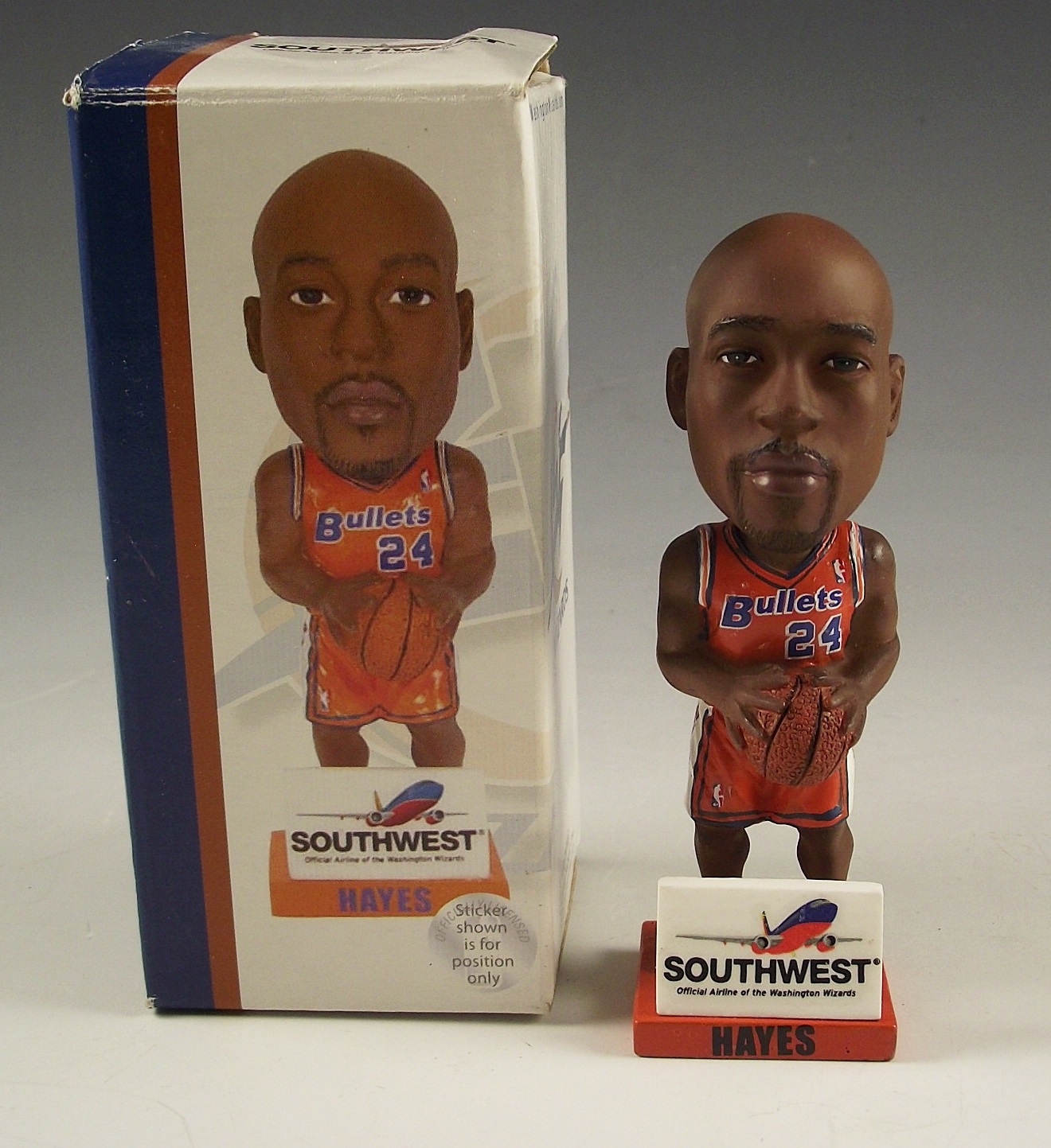 Trio of collectible sports themed items.