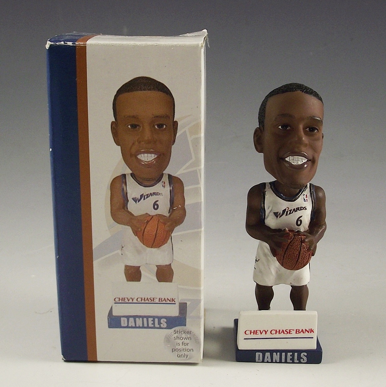 Trio of collectible sports themed items.